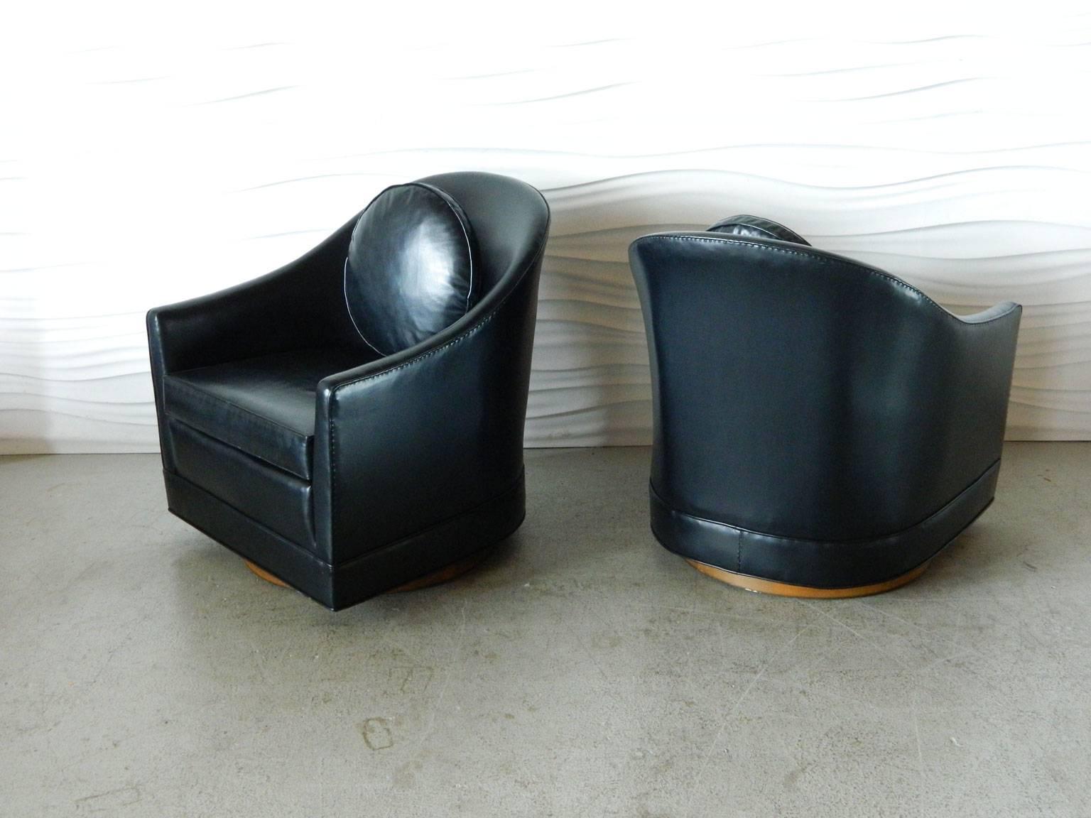 Handsome pair of Harvey Probber swivel chairs with curved backs.