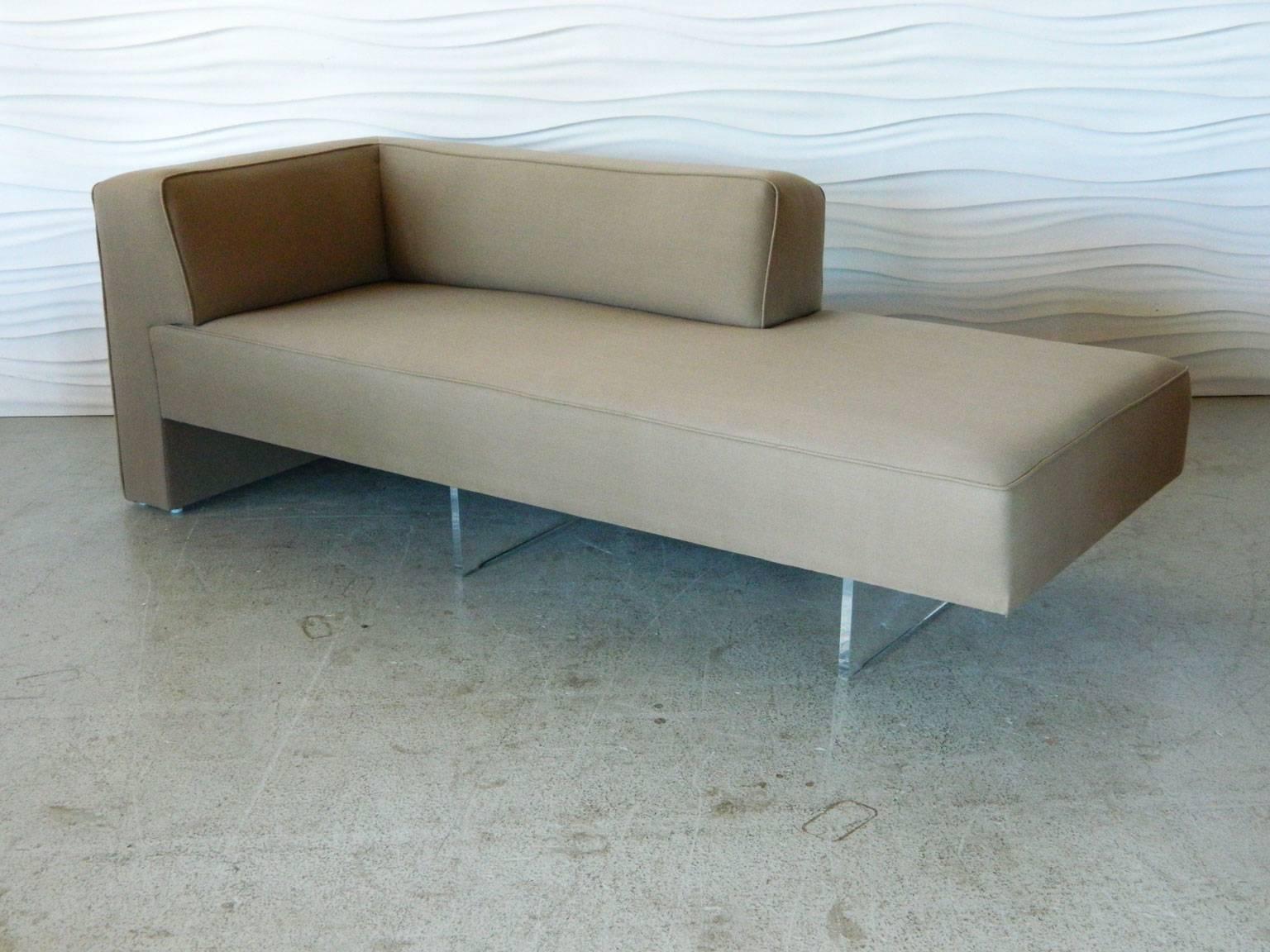 Designed by Vladimir Kagan in the 1970s, the Omnibus sectional sofa appears to float thanks to its Lucite base.

This sectional grouping includes:
1- corner sofa (80 inches long, 33 inches deep, 28 inches high; seat height 17 inches)
2- slipper