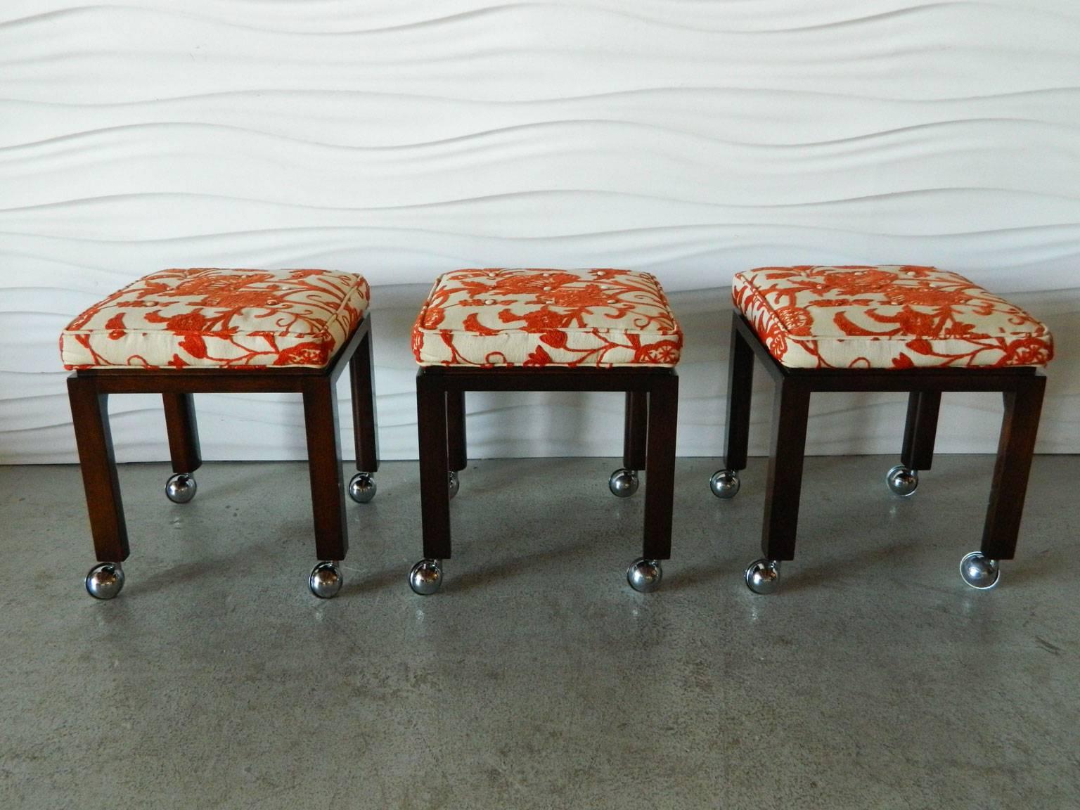 Classic 1960s Harvey Probber stools with original finish, upholstered crewel work seats, and casters.
