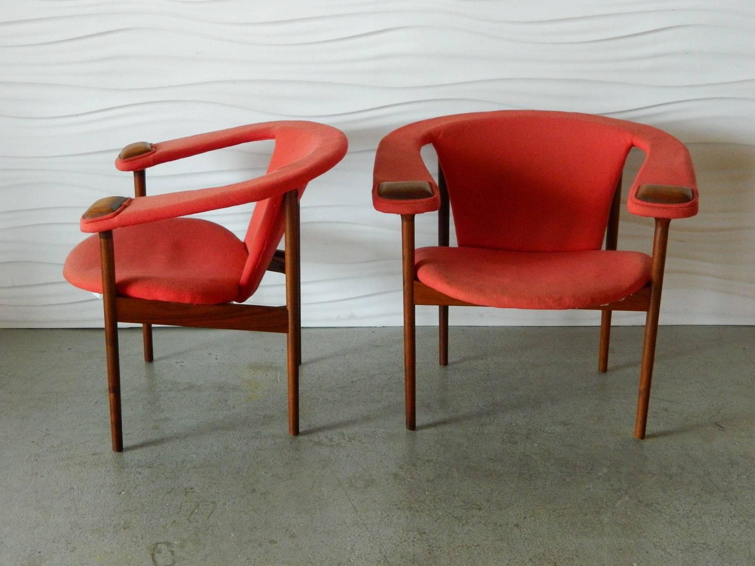 Designed by American designer Adrian Pearsall for Craft and Associates, this pair of armchairs features rounded back supports and wood details on the arms.
 