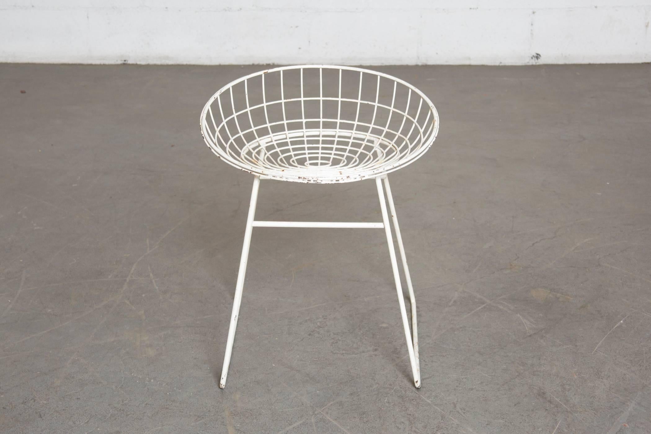 White enameled wire vanity stool or outdoor chair by Braakman and Dekker. Original condition with visible signs of wear and loss to enamel and some surface rust.