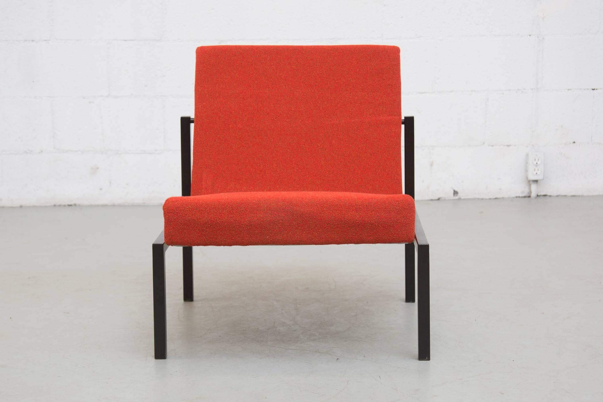 Stunning Martin Visser armless lounge chair with tomato red fabric and original black enameled metal frame. Visible signs of wear on frame.