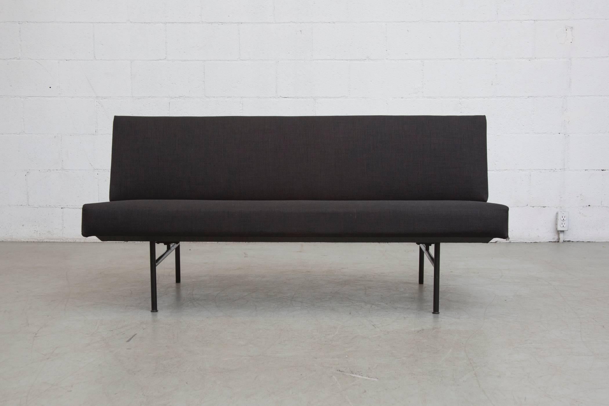 Black on black. Newly upholstered modern sofa attributed to Coen de Vries. Original black enemeled metal frame with some signs of wear, normal for its age and usage.