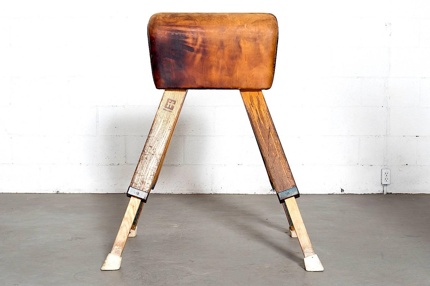 Original 1960s gym horse in natural leather with an amazing patina. Height adjustable. In original used condition.