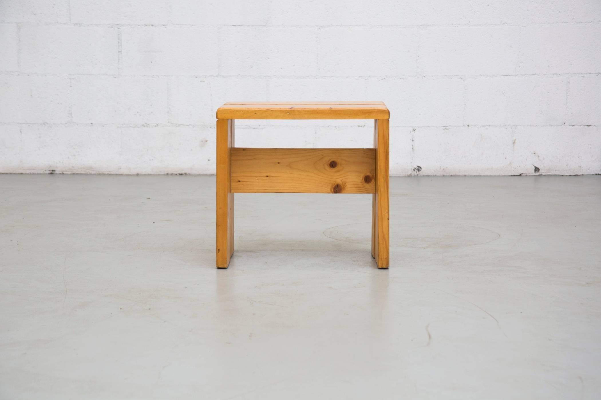 Charlotte Perriand solid pine stool from Les Arcs, France, circa 1968. In good original condition with some wear to surface consistent with age and use.
