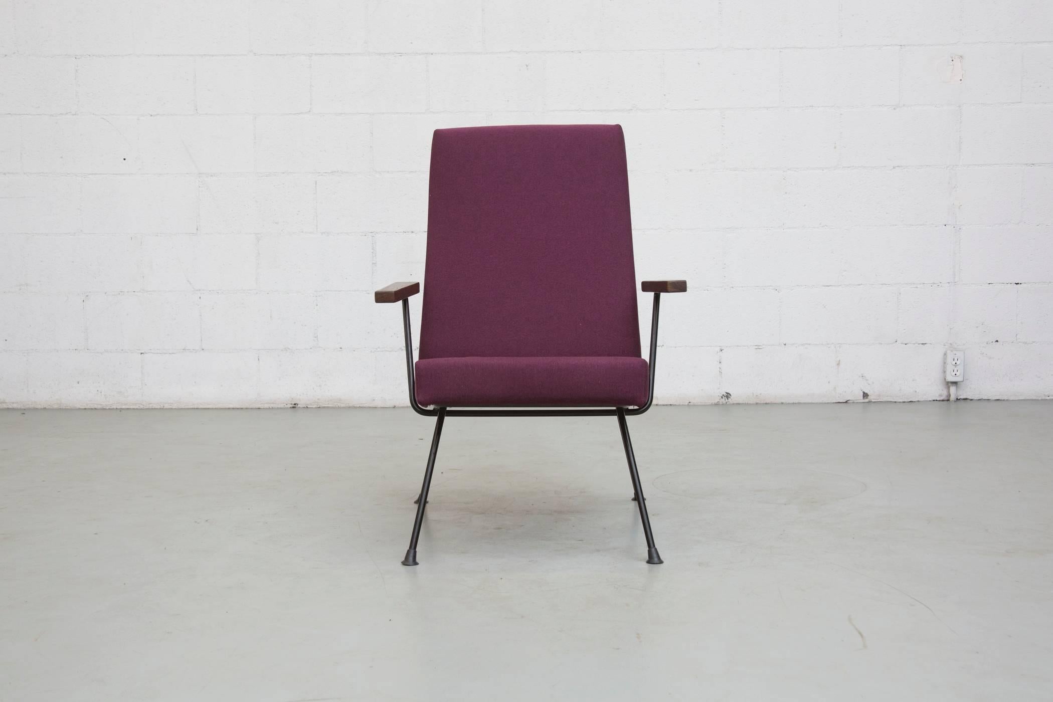 Kembo chair designed by Wim Rietveld. Black enameled body. Wire legs and arms with Wenge arm rests. Freshly upholstered in plum. Frame in original condition with some signs of wear.