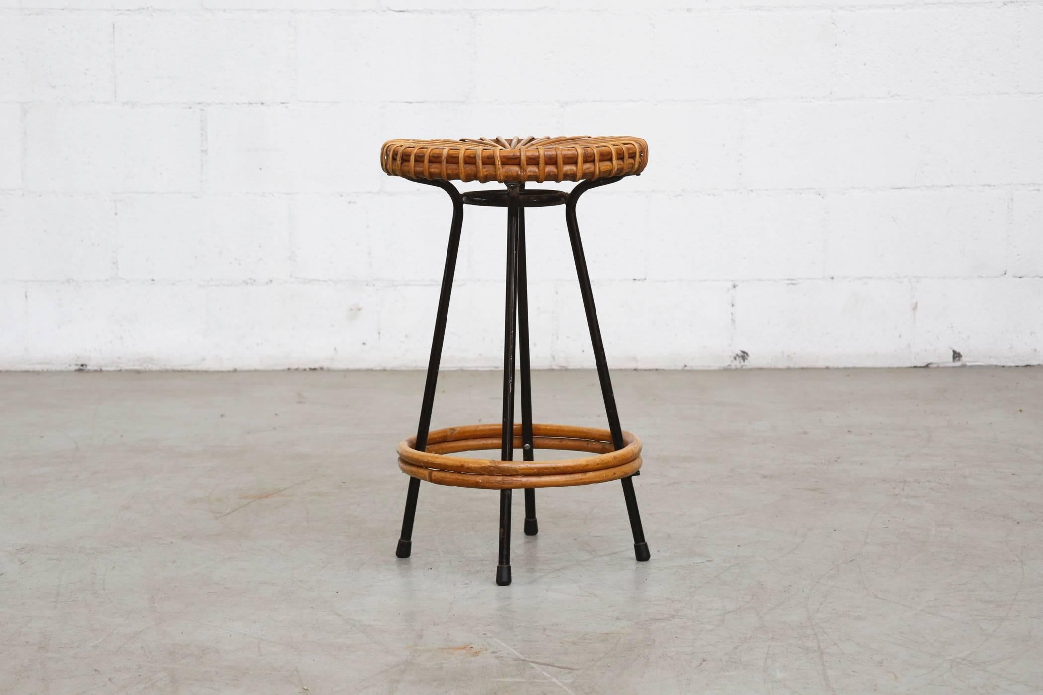 Great wire framed stools with woven bamboo seat and matching bamboo foot rest. Original condition with some wear to bamboo and enamel frame consistent with age and use. Set price.