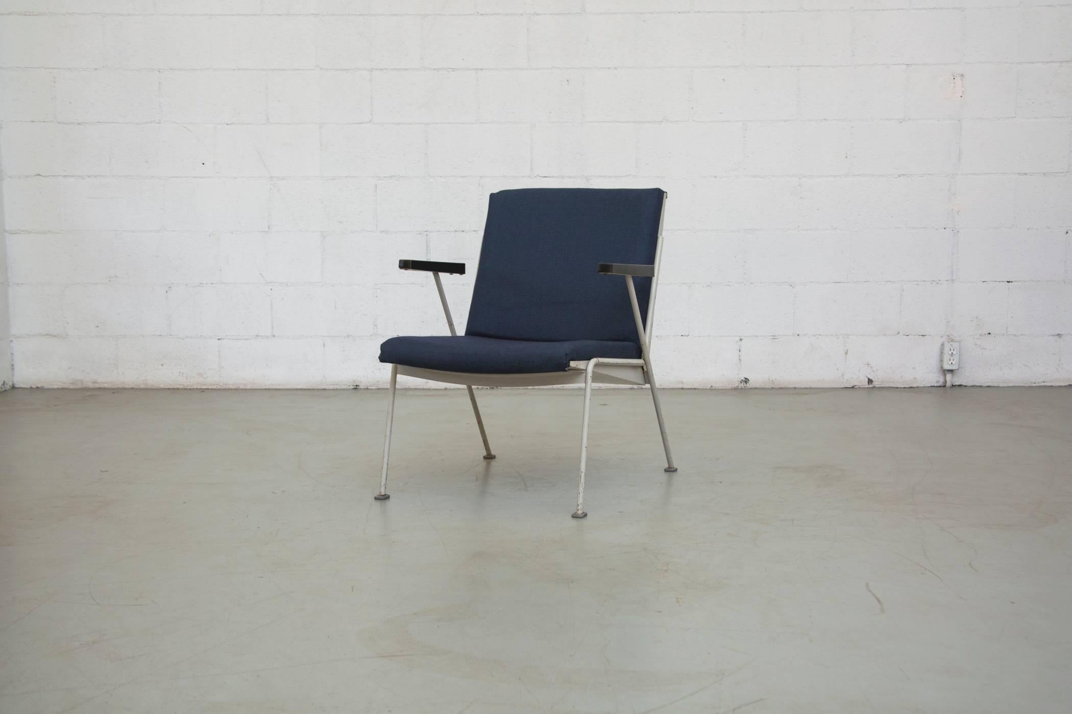 Ahrend de Cirkel Enamel Framed Lounge Chair with Bakelite Arm Rests by Wim Rietveld. All in New Navy Blue Upholstery and Light Grey-Almost White, Enameled Metal Frames in Original Condition. Wear is Consistent with their age and usage.