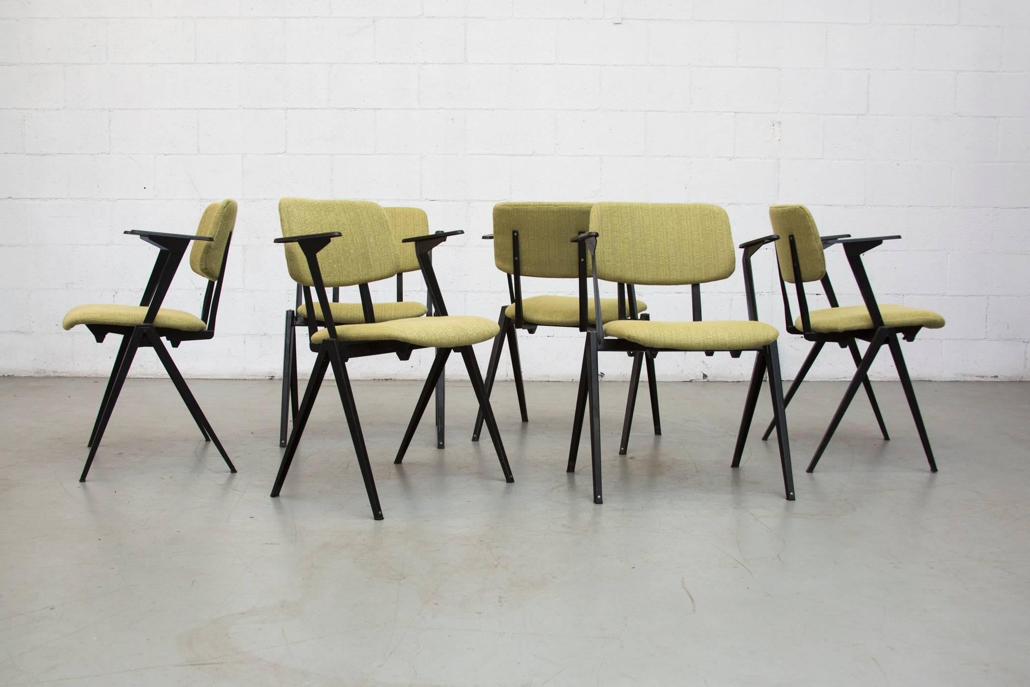 Set of six upholstered stacking chairs with folded sheet metal prouve style legs and new grass green upholstered seat and back. Frame in original condition. Stacks 4 high.