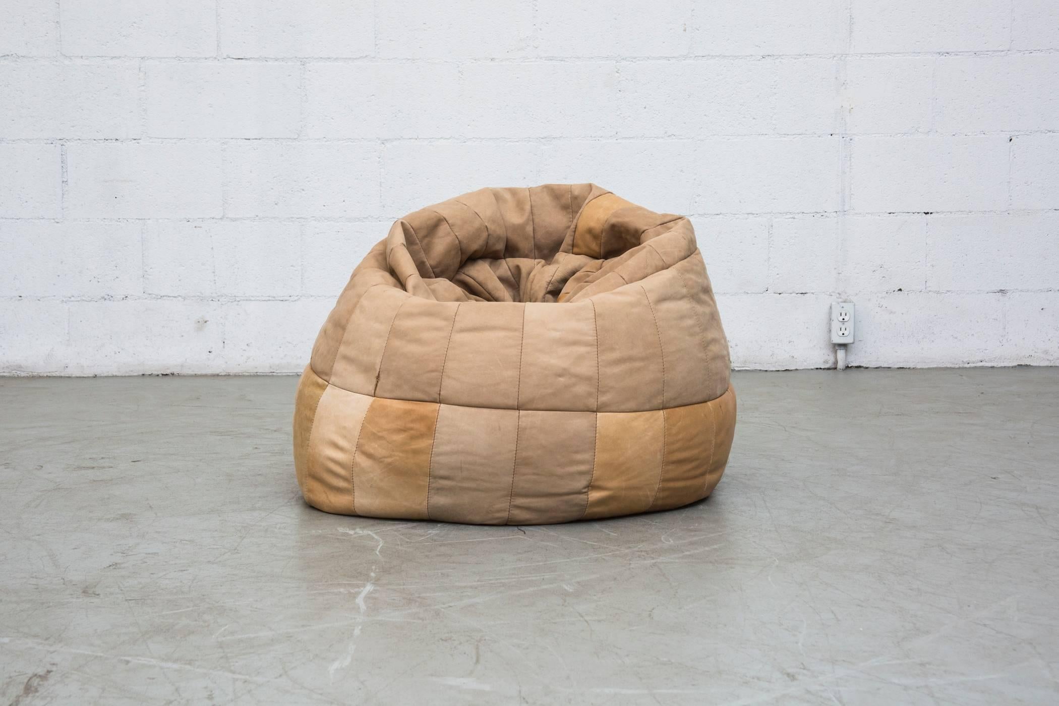 1970s De Sede style leather patchwork beanbag chair. Soft natural leather with nice patina. Small seam separation at bottom, but in overall good vintage condition.