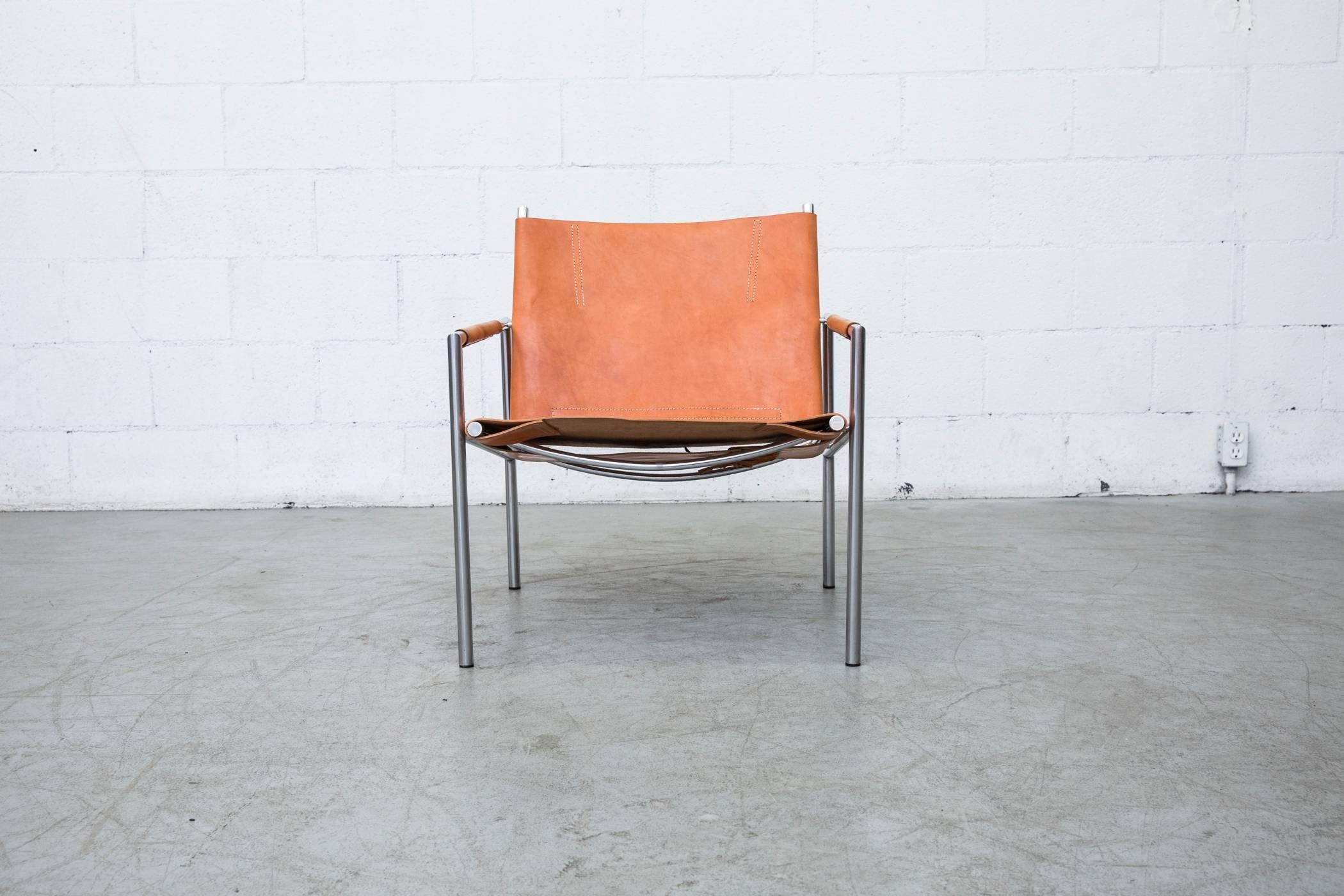 Martin Visser SZ01 lounge chair in new natural saddle leather with original leather detail on armrests and visible patina. Chrome-plated frame also in original condition. Designed for t'Spectrum in 1960. Another one is available with original