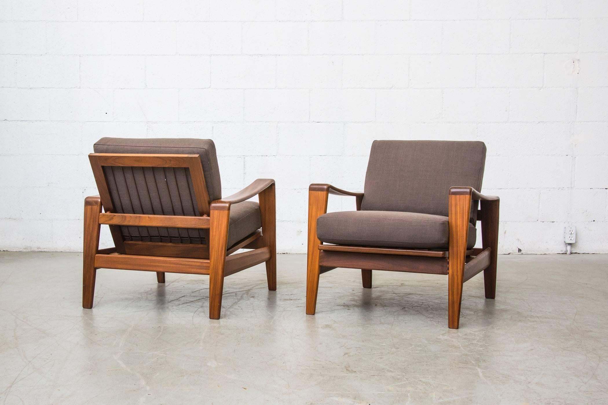 Beautiful organic ribbon like teak frames with new upholstery and strapping. Nice sleek lines with exposed back. Arne Wahl Iversen lounge chair, Komfort, Denmark, 1960. Set price.