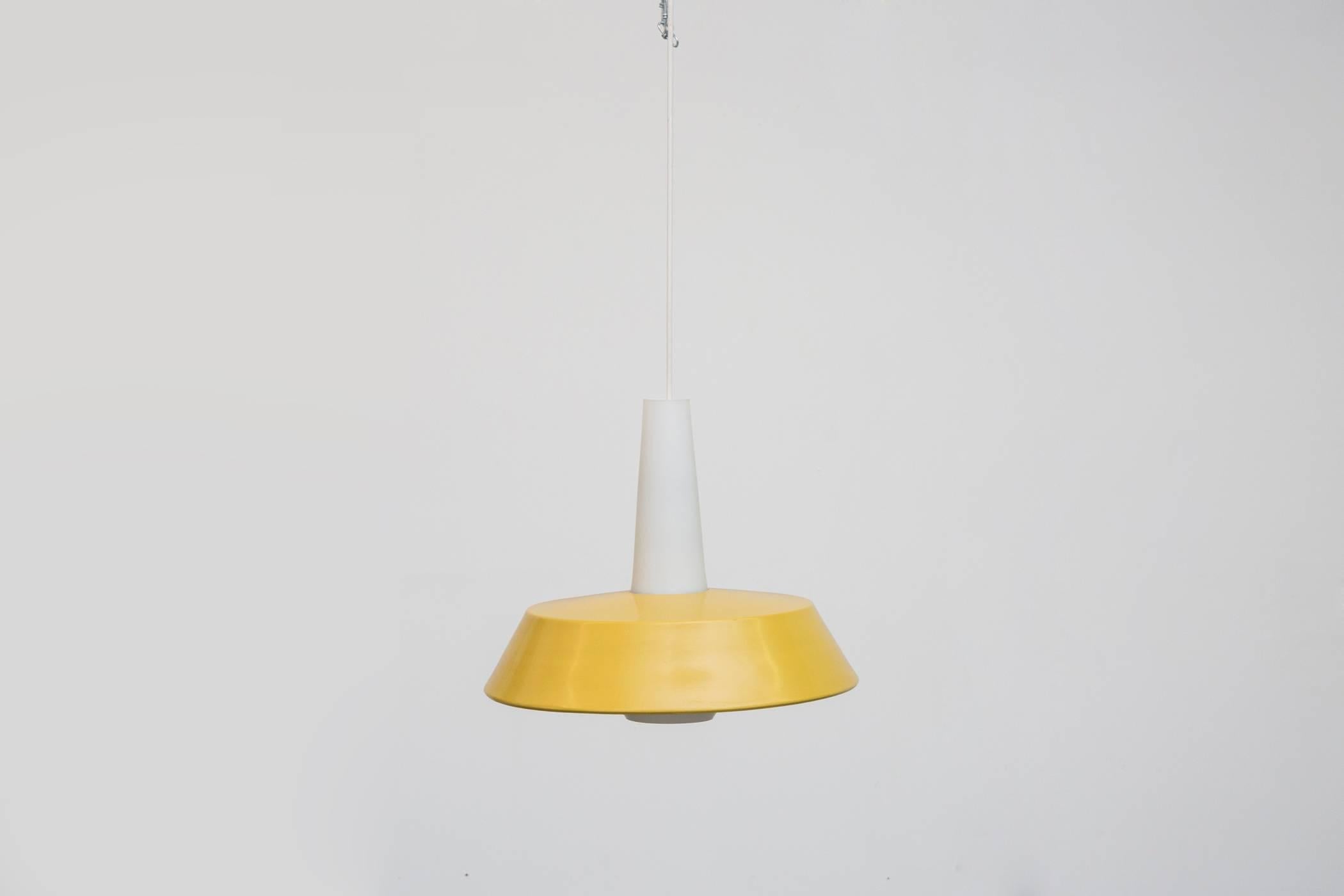 Amazing shaped milk glass lamp with enameled yellow metal hat shade. Nice original condition.