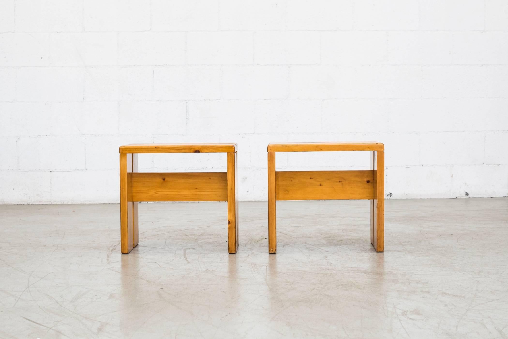 Charlotte Perriand solid pine stools from Les Arcs, France, circa 1968. In good original condition with some wear to surface consistent with age and use. Wood grains vary from set to set. Larger bench version available (S698) set price.