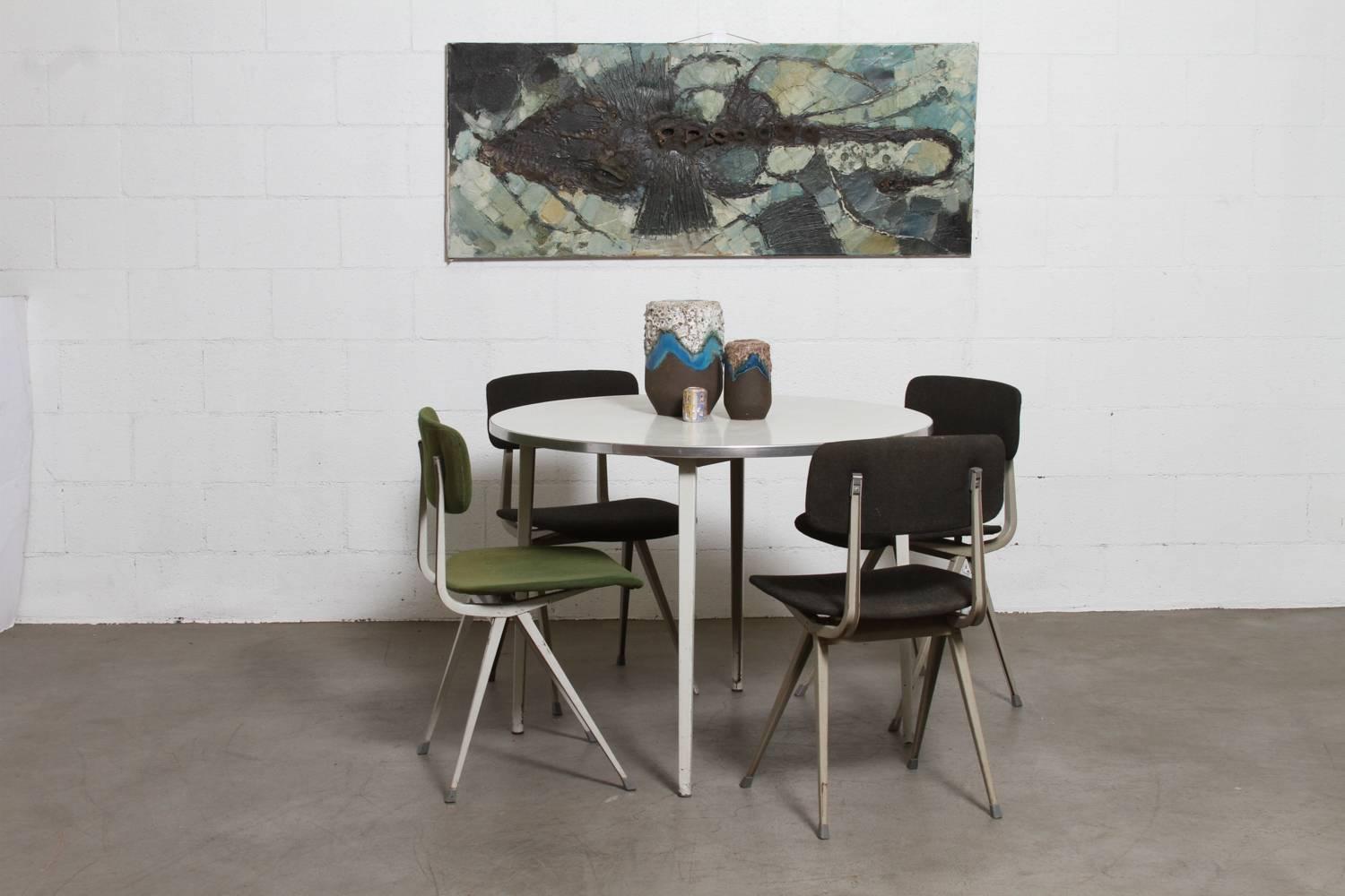 Rare, round Industrial table from the Dutch Industrial designer Friso Kramer, 1955. Aluminum edge with dove grey enameled legs and white top. Frame and top in original condition with visible signs of wear.