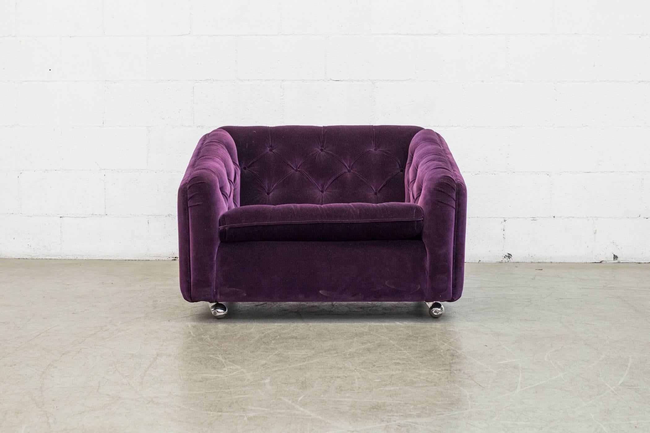 Amazing comfy Artifort tufted lounge chair by Geoffrey Harcourt newly upholstered in amethyst velvet sofa on rollers. Matching tufted love seat available, listed separately.