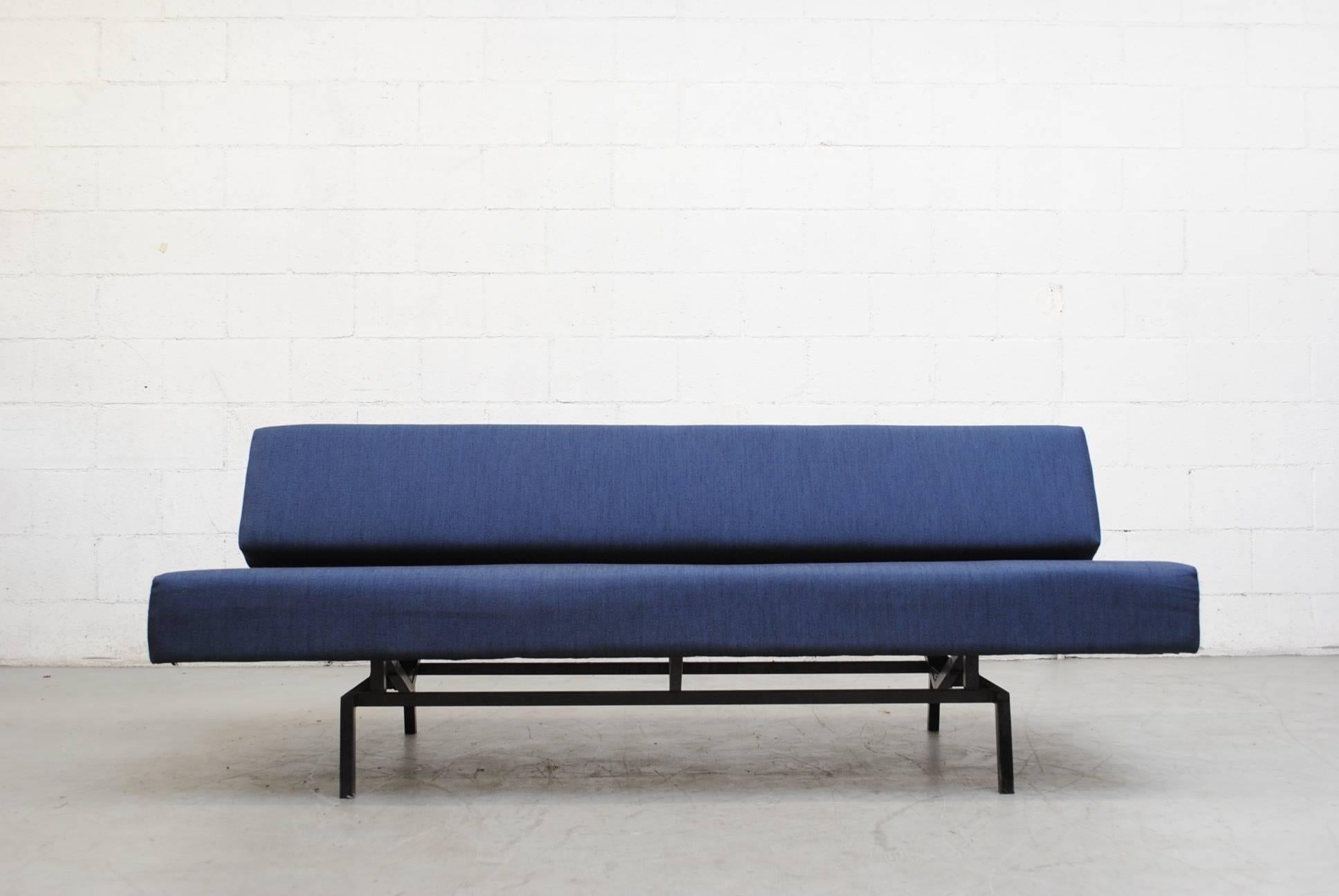 Beautiful Martin Visser sleeper sofa with pull out bench that levels to day bed size. Newly upholstered in blue fabric. Black enameled metal frame in original condition with visible signs of wear.