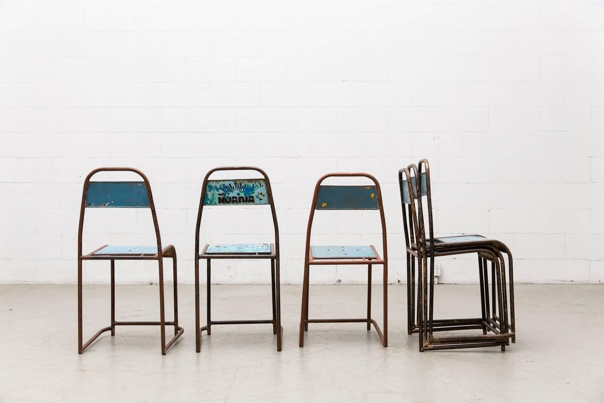 All metal Industrial stacking chairs with visible patina and wear. All in very used condition, but oh-so-cool! Priced individually.