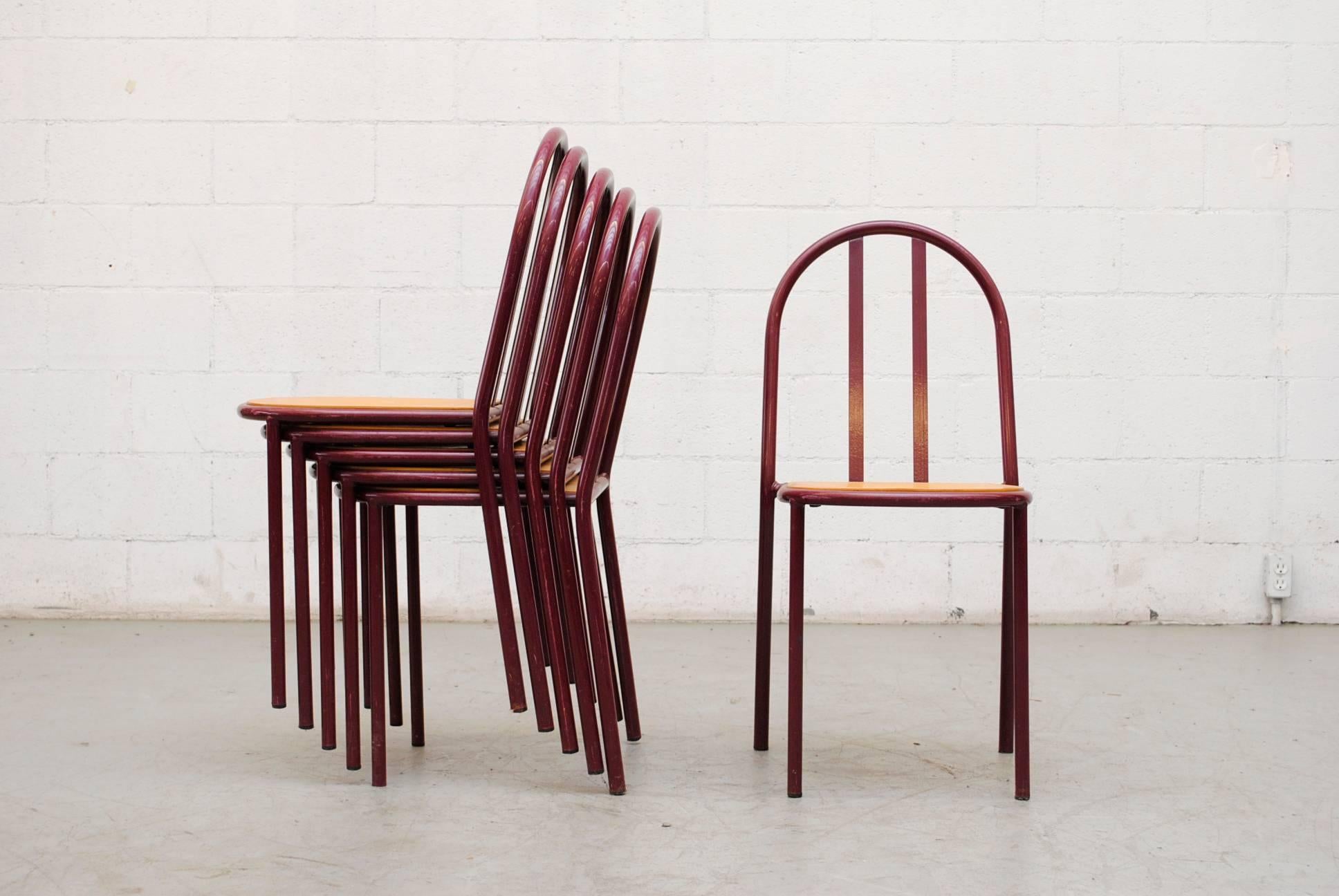 Thonet inspired maroon enameled metal frame with inset birchwood seats all in good original condition with wear consistent with their age and usage.