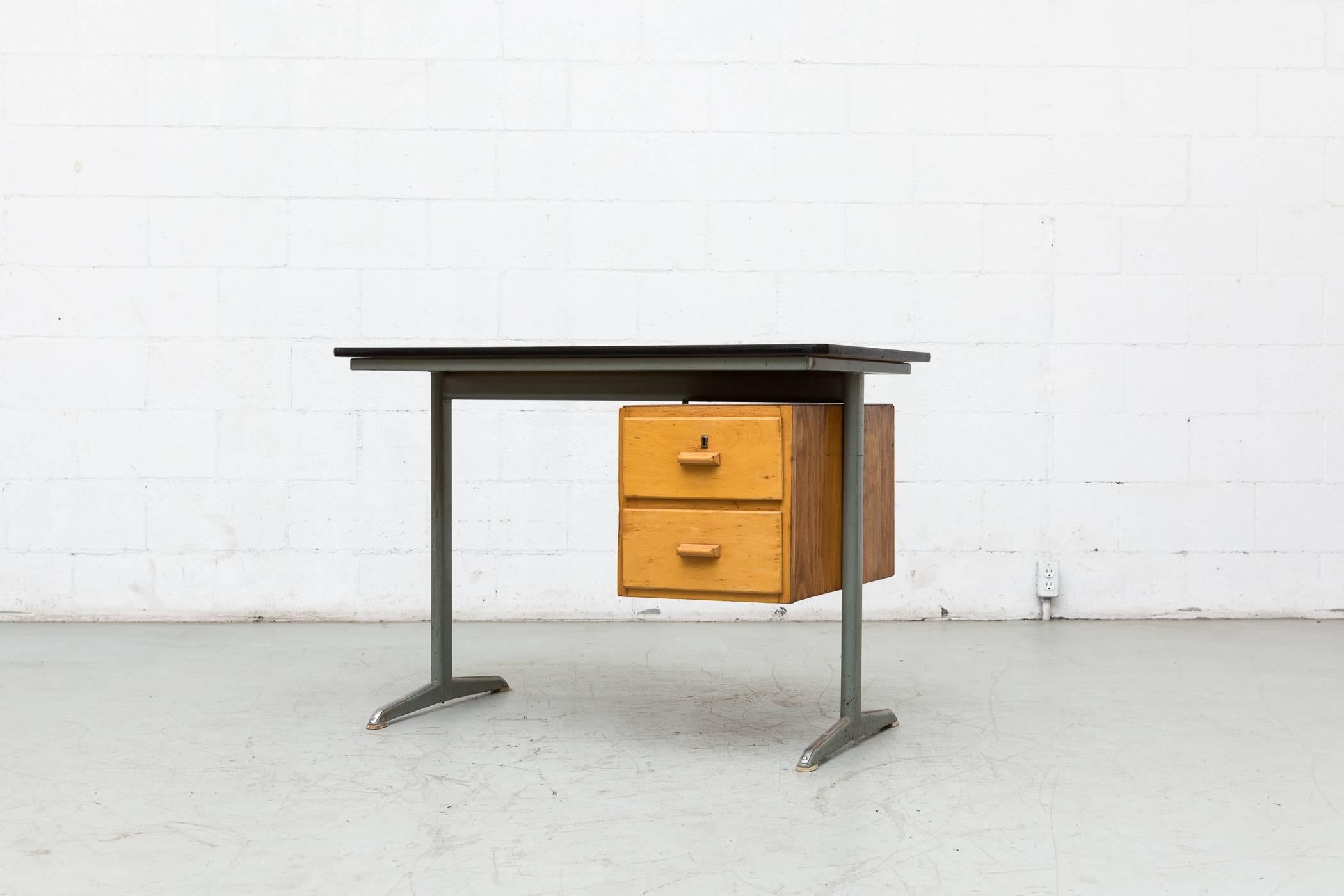 Industrial metal frame with birch drawers and Formica top and Friso Kramer style legs in original condition.