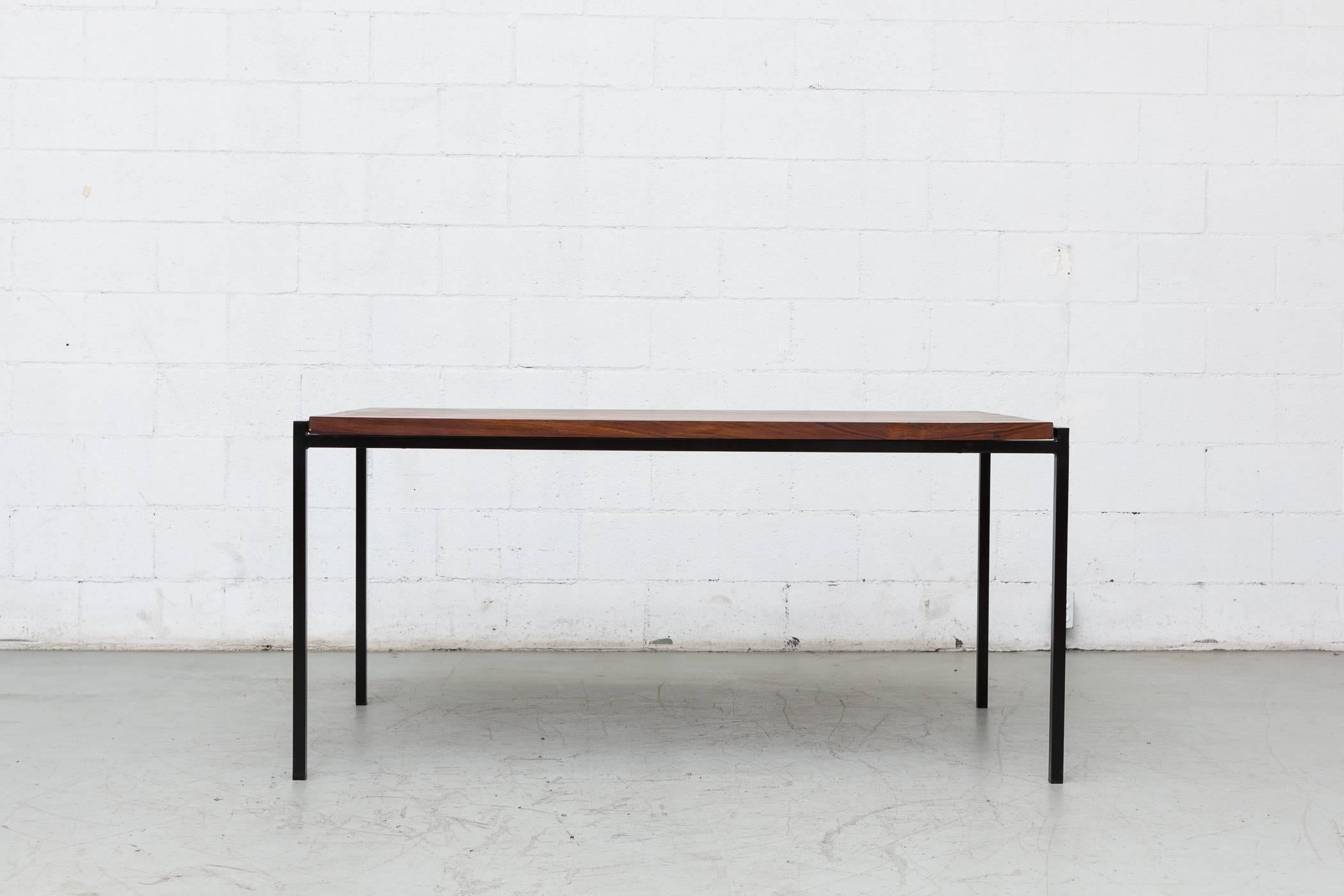 Rosewood topped black enameled metal table in good original condition in the style of Cees Braakman's Japanese Series dining table. Some wear to the frame consistent with its age and usage. Other similar tables available and listed separately.