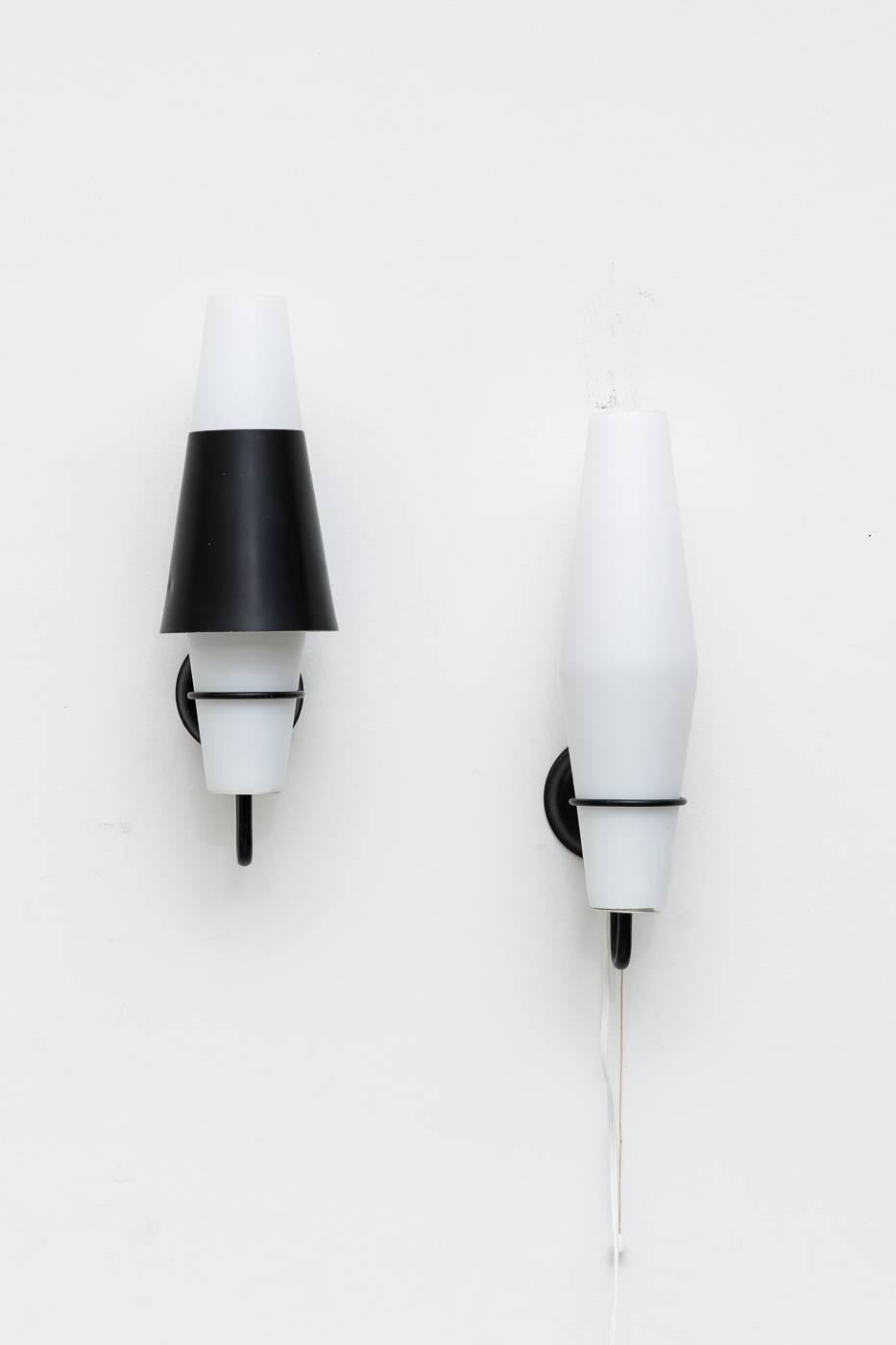 Milk glass shade with enameled metal coned cap. Two available with caps, one with a pull string switch, one is ready for hard wire. Nut caps vary.