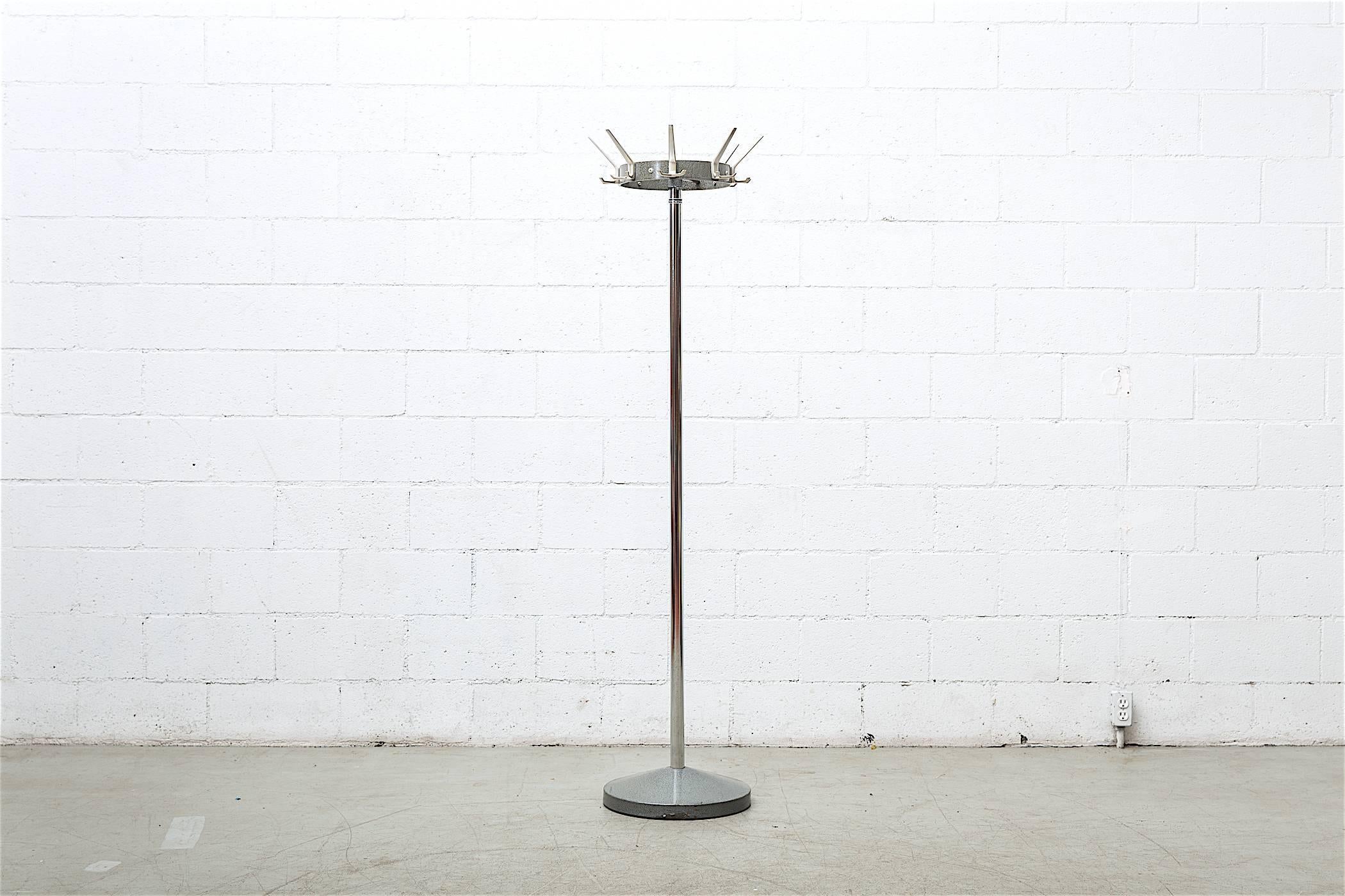 Standing Industrial coat rack with spinning top, chrome post, cast aluminum hooks and heavy grey enameled metal weighted base. Original condition with visible wear.