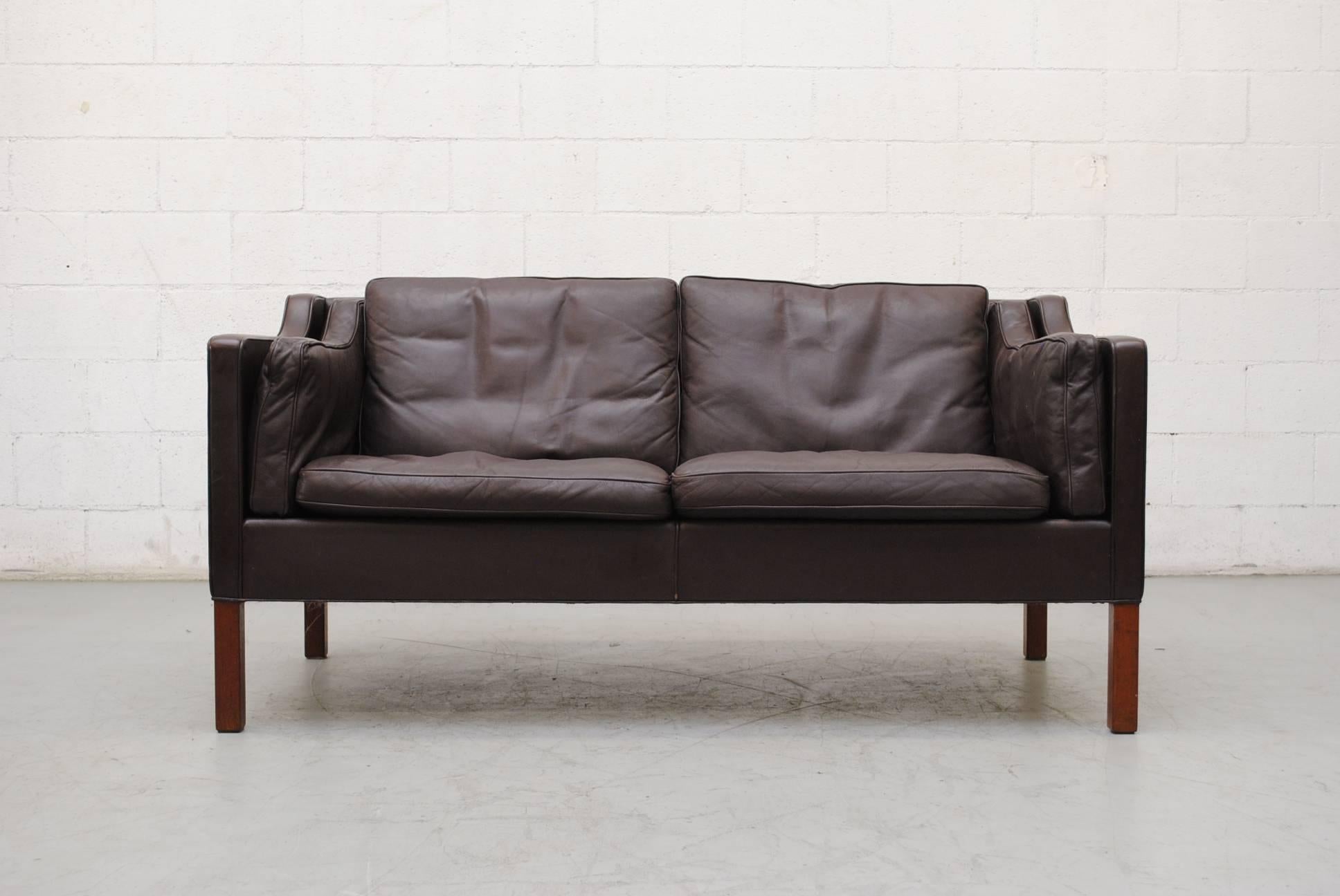 Nice chocolate brown leather Borge Mogensen loveseat. Square wood legs. Good original condition, Wear consistent with its age and usage.