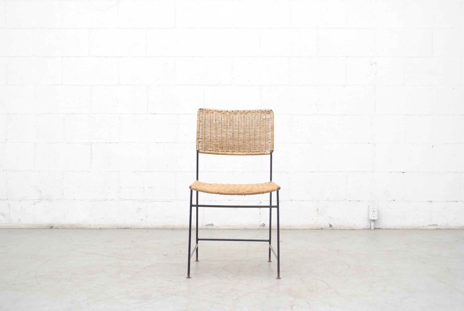 Rare set of four 'SW 88' chair, designed in 1954. Enameled black metal and cane work. Original condition, visible wear and minimal breakage in rattan. Set price.