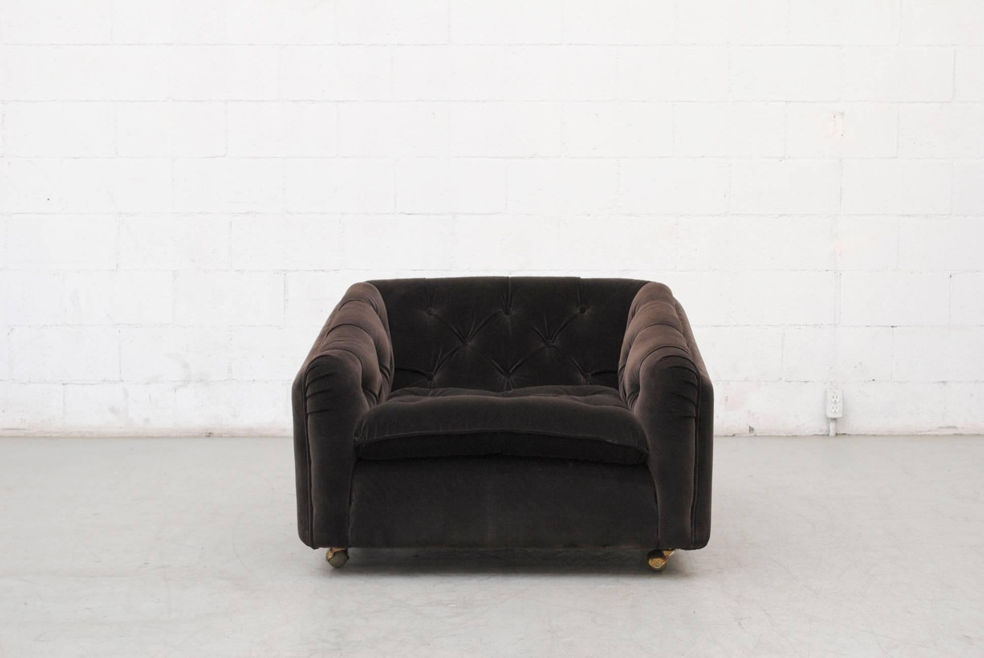 Gorgeous dark grey tufted velvet lounge chair for artifort on metal rolling caster wheels.