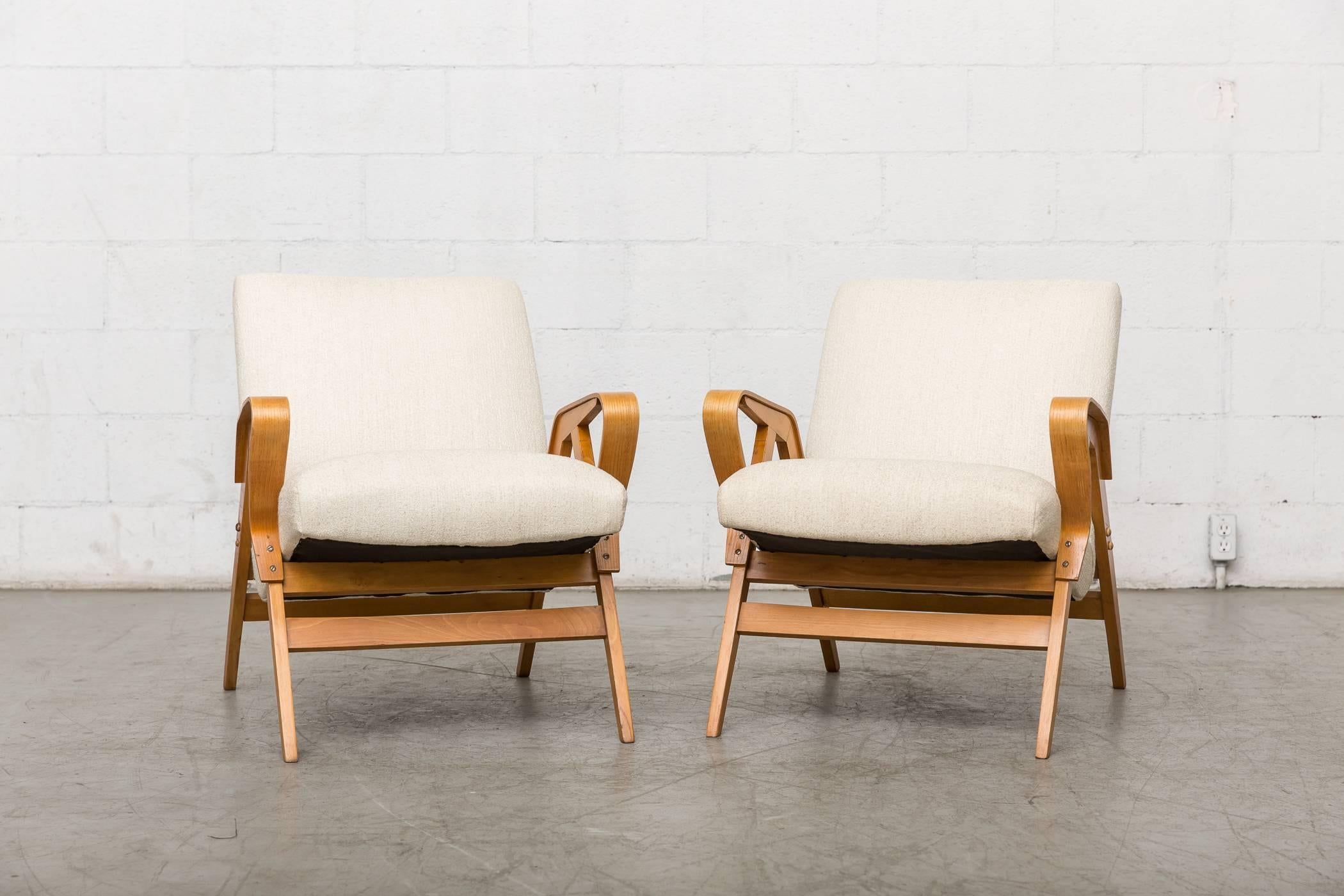 Gorgeous Pair of Tatra Lounge Chairs with Bent Beechwood Arm Rests, 1960s Czechoslovakia. Newly Upholstered in Bone White Fabric. Frames in Original Condition. Set Price.
