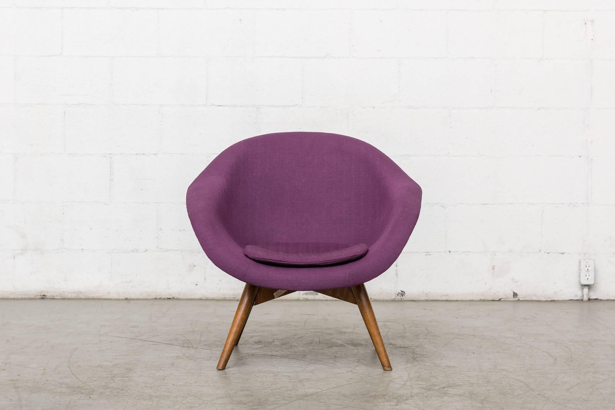 Newly upholstered purple Saarinen Style Mid-Century Modern bucket chair by Miroslav Navratil with dark stained legs. Frame is in original condition.
