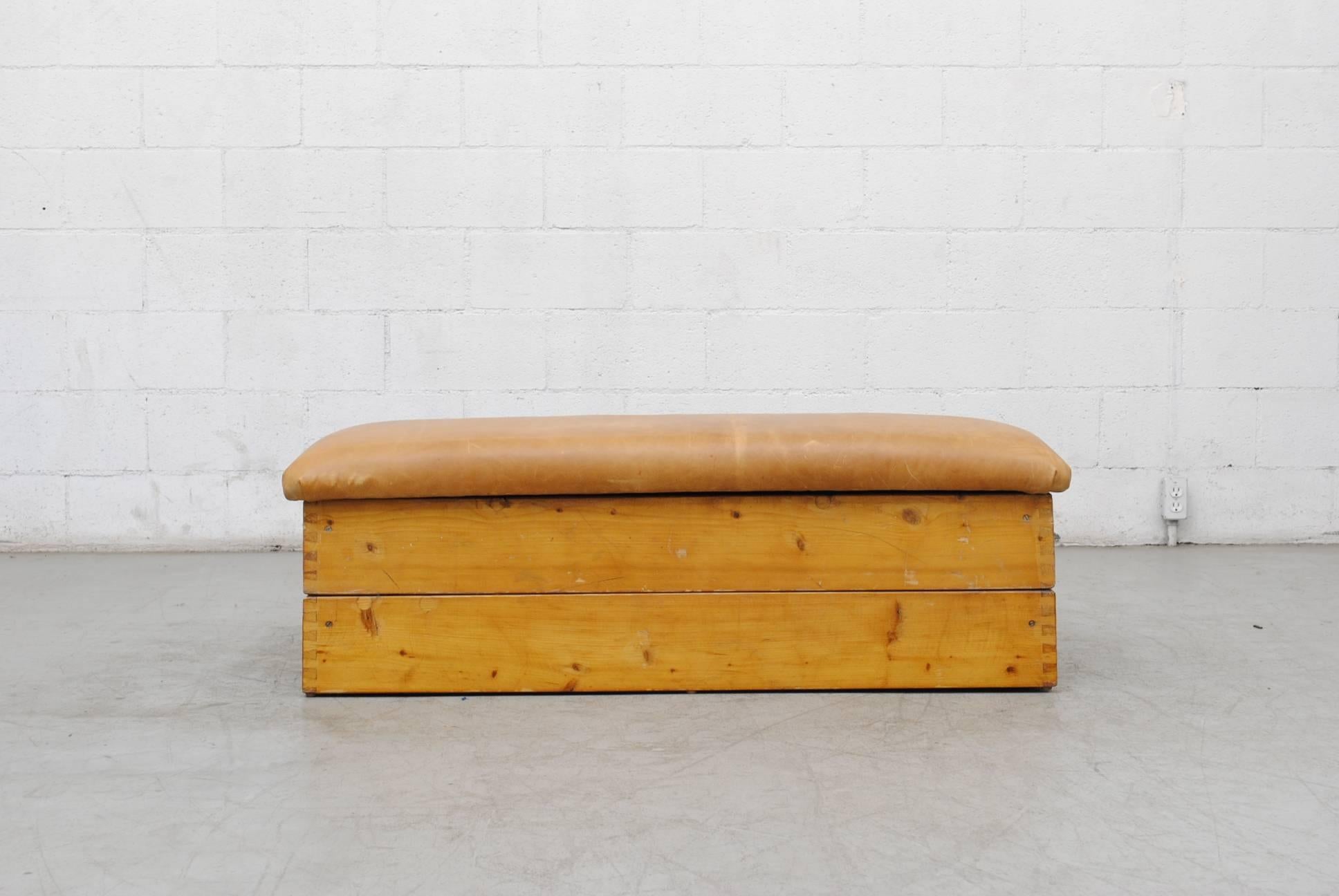 Original Dutch gymnastics vault transformed into a low multipurpose ottoman-bench-coffee table in teak and oak with leather top. Two-tiered stack-able.