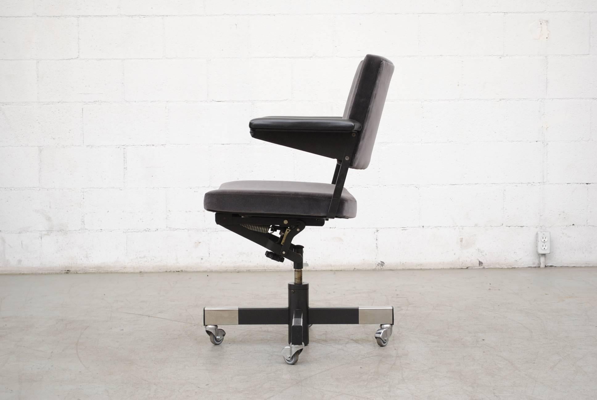 Awesome rolling industrial rolling office chair by Gispen, newly upholstered in grey velvet with original vintage vinyl arm rests with adjustable seat height. Frame in original condition.