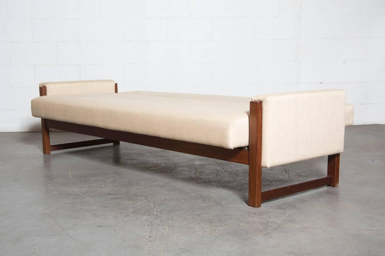 Beautiful Classic Mid-Century Sofa Sleeper by Yngve Ekstrom for UMS Pastoe, 1960's. Newly Re-finished and Reupholstered. Seat Back Folds Down Completely to Create a Flat Bed. Small Crack to Wood on Back of one Armrest, probably from Age, Not