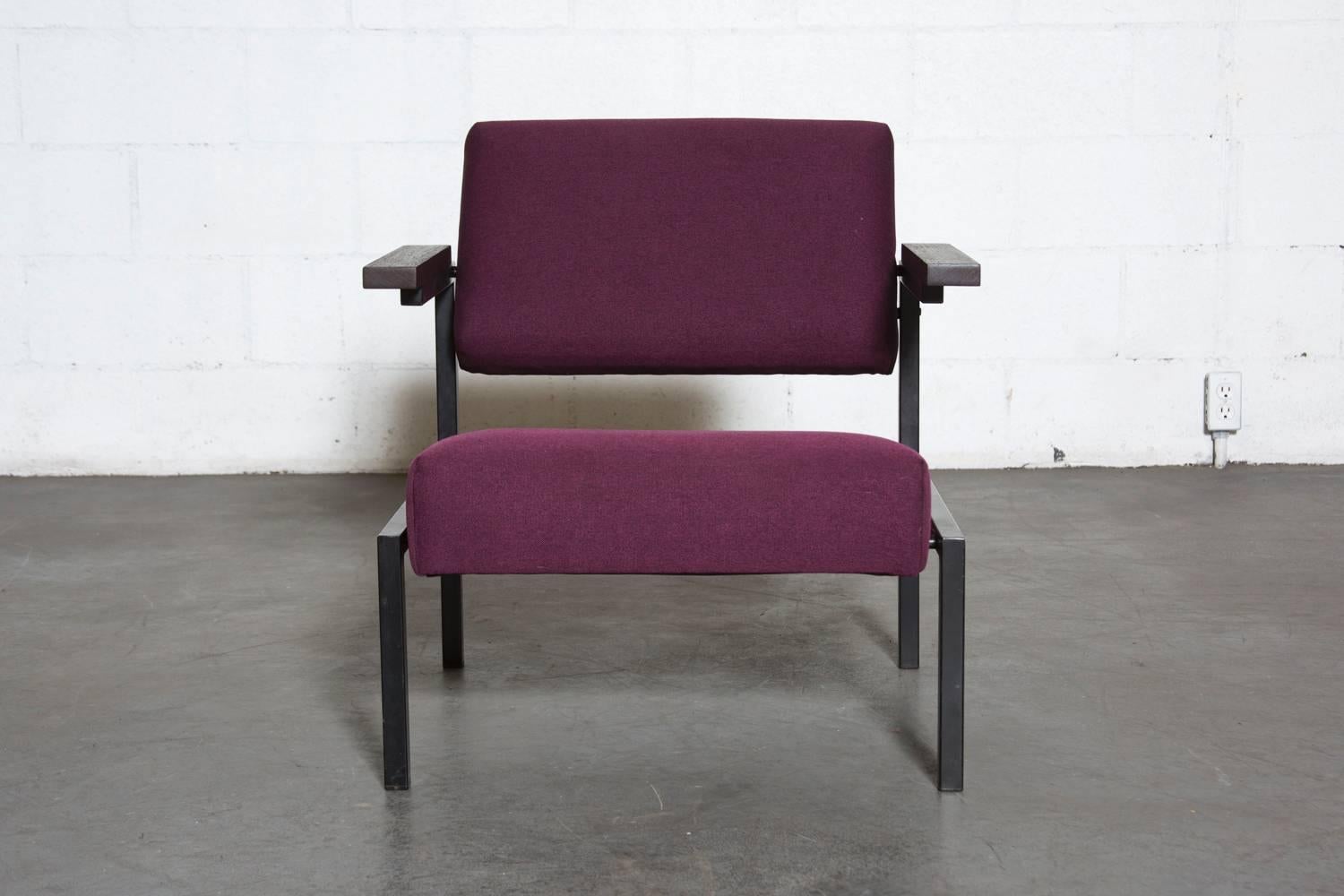 This Black Enameled Metal Frame Lounge Chair with Outreaching Wenge Arm Rests, Re-upholstered in Grape Fabric is a Classic. Frame is in Original Condition with Some Visible Wear to the Enamel, Newly Reupholstered. 

Martin Visser began working for