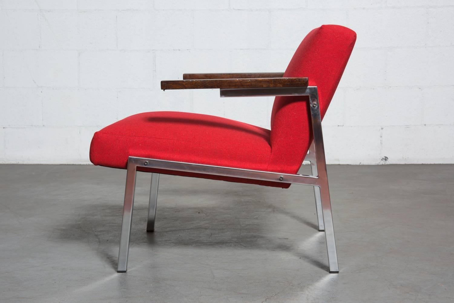 Mid century chair by Martin Visser for  Dutch furniture manufacturer ’t Spectrum. This 1964 piece, the SZ 66 lounge chair ( a “her’s” version to the “his” counter part, the SZ 67 chair) features a chrome frame and wenge arm rests. Newly upholstered