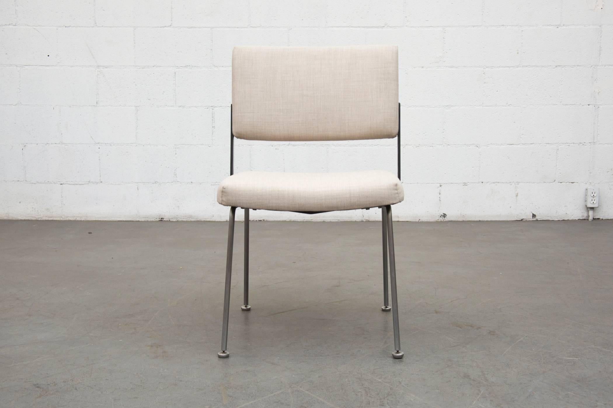 Great architectural chair newly upholstered in dove grey fabric with wide body, black enameled metal Frame and brushed steel legs. Set price. Frame is in original condition with some wear consistent with age and use.