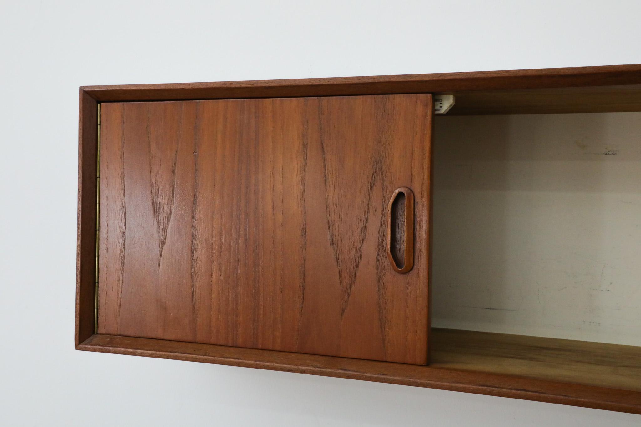 Poul Cadovius Style Wall Mount Teak Cabinet In Good Condition For Sale In Los Angeles, CA