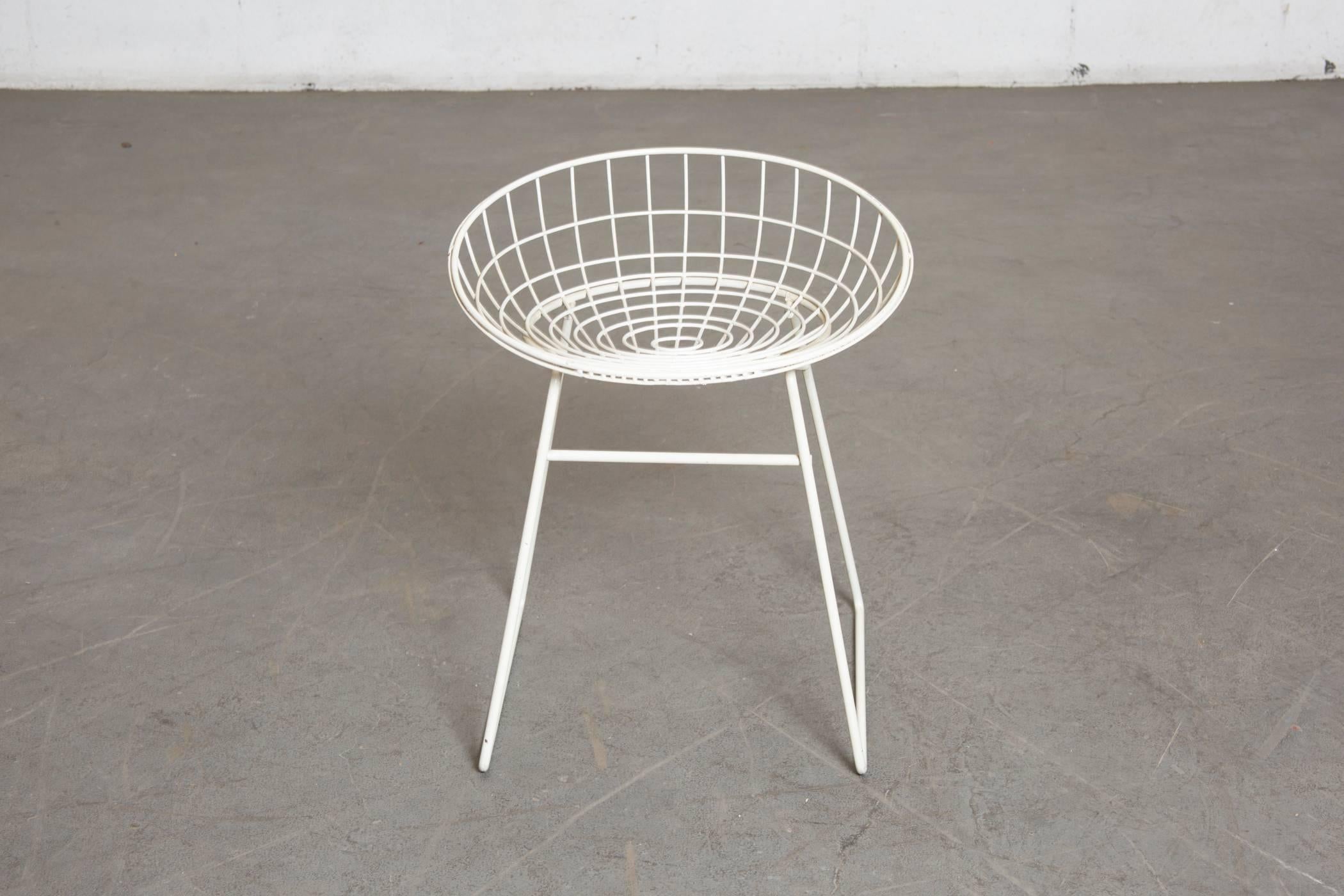 White enameled wire vanity stool or outdoor chair by Braakman and Dekker. Original condition with visible signs of wear to Enamel and some surface rust.