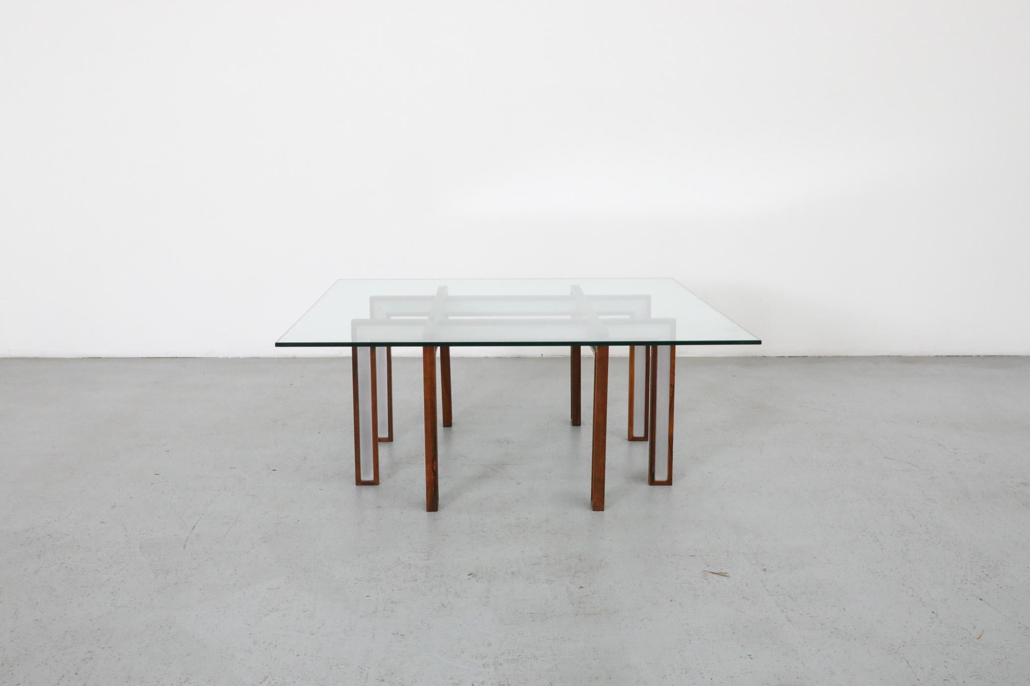 Danish Mid-Century, 1960's, Henning Korch for C. F. Christensen coffee or side table. Spider-like rosewood frame with inset aluminum detail and new plate glass top. Delicate construction with some warping of the legs due to age. In original