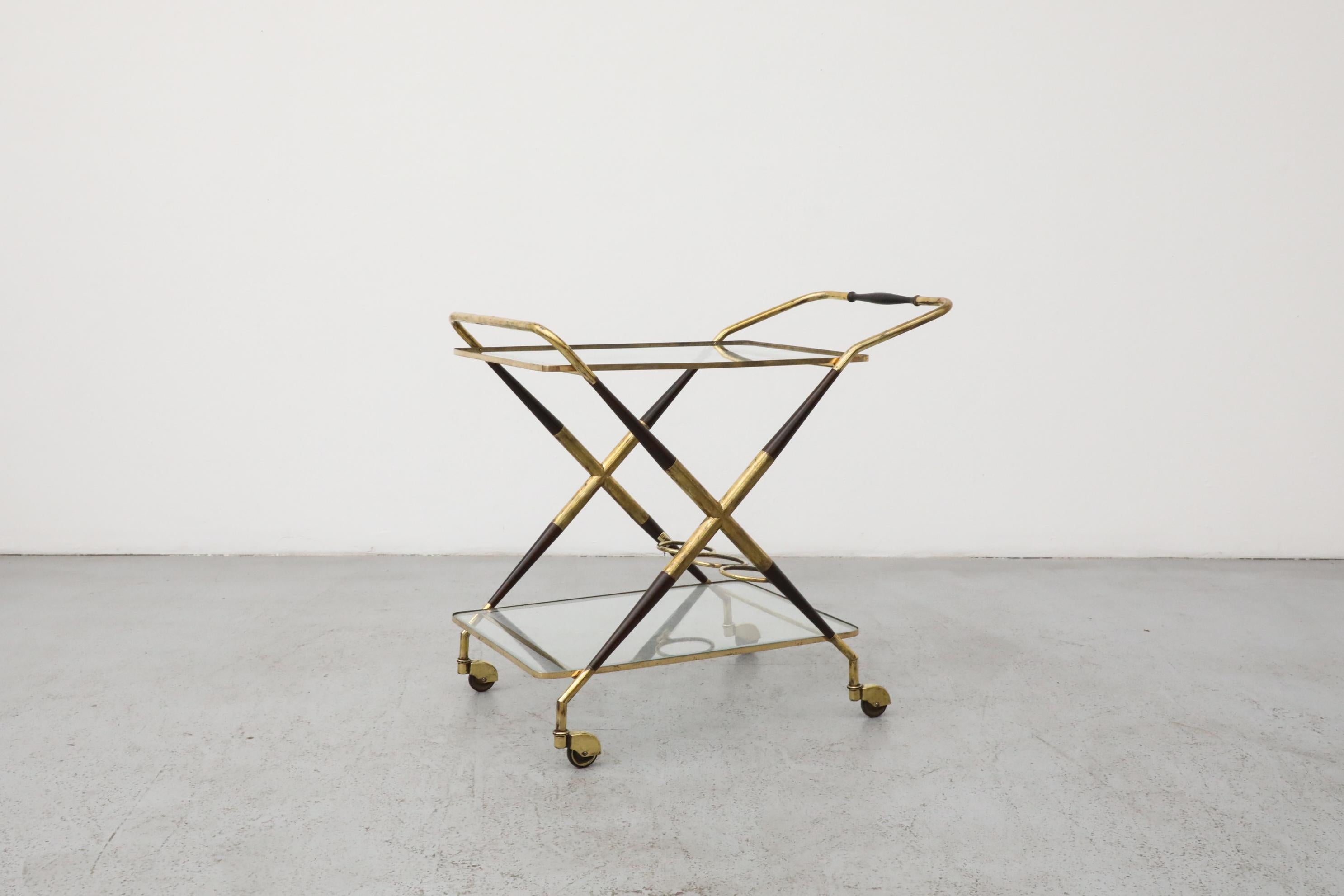 Elegant  Mid-Century Italian bar cart or tea trolley in the style of Ico Parisi, featuring a sophisticated two-tiered design with brass and black lacquer accents. This vintage serving cart showcases refined Italian craftsmanship and sleek styling,