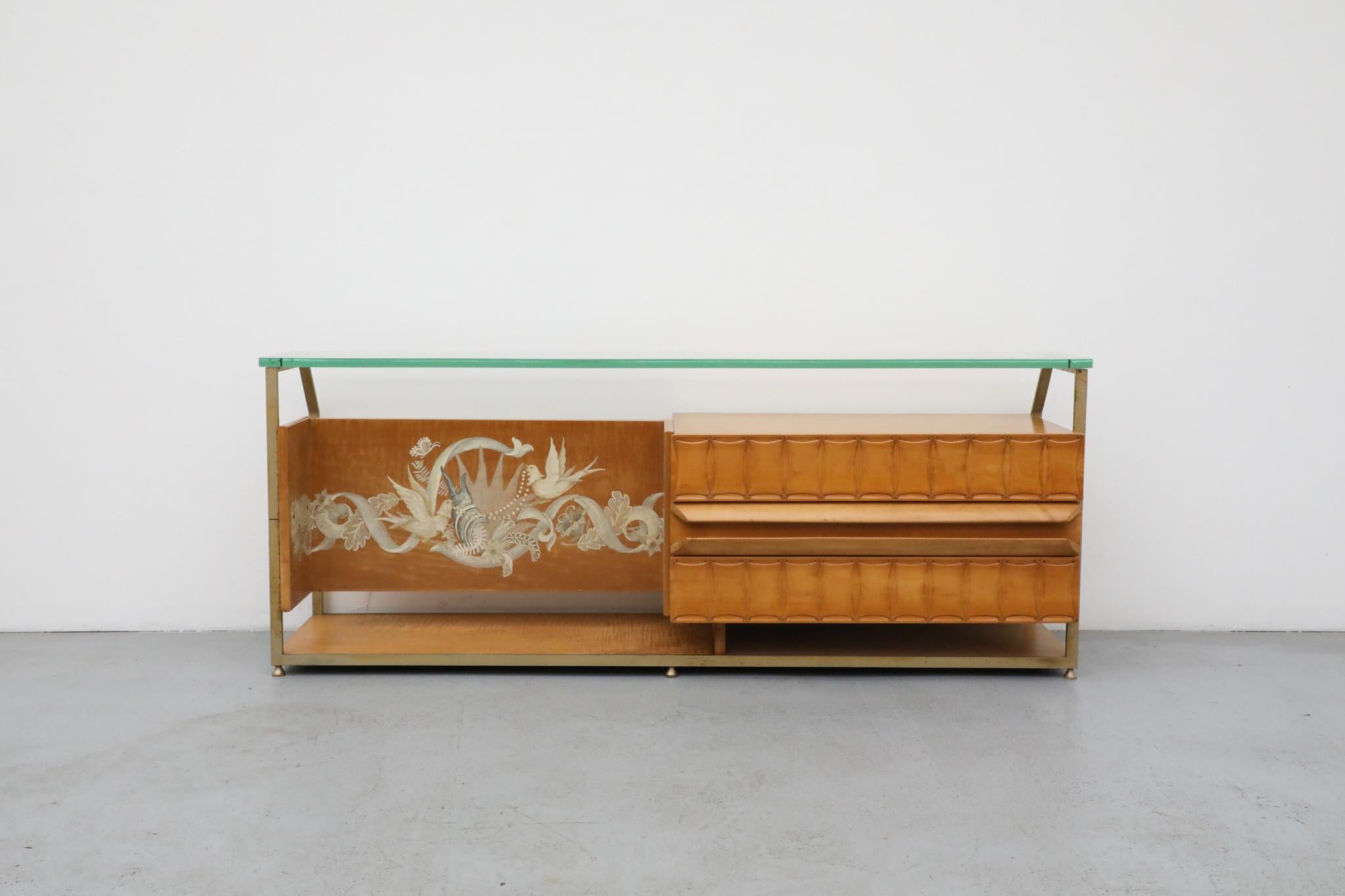 A remarkable 1950s Italian console with a glass top, produced by La Permanente Mobili Cantu. This piece embodies the elegant modernism often associated with Gio Ponti, a hallmark of mid-century Italian design. Its sophisticated form is attributed to