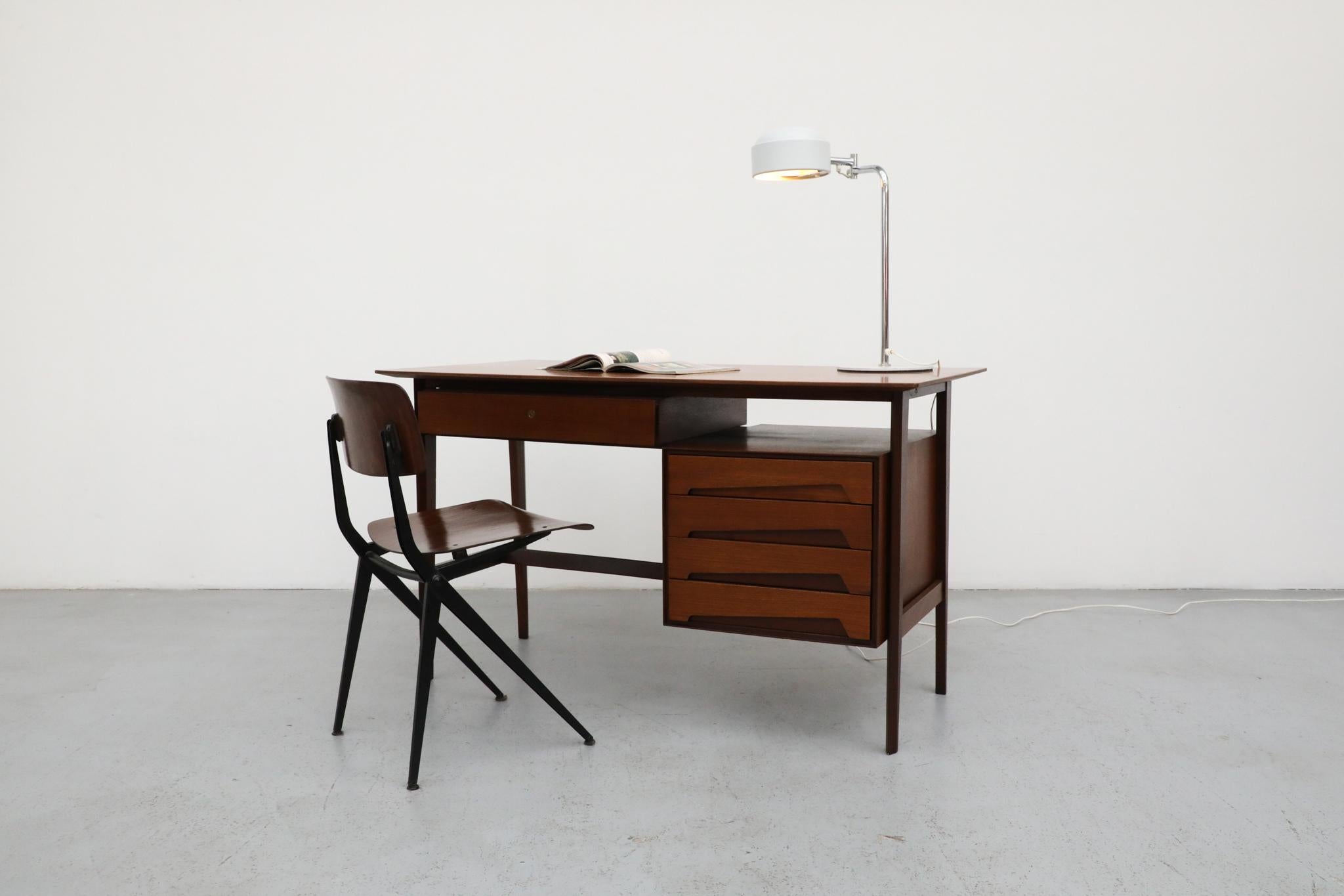  gorgeous example of post-war European modernism, this Mid-Century teak desk or vanity was designed by Edmondo Palutari for Dassi Arredamenti Lissone. Embodying the sophisticated elegance of Gio Ponti style, this piece showcases the best of Italian