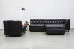 Grand Black Leather Tufted Sectional Sofa with Ottoman