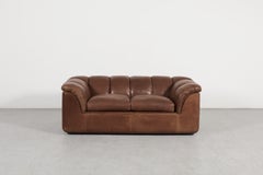 Canapé deux places « Cocker » de Poltrona Frau en cuir marron, par Franco Bresciani