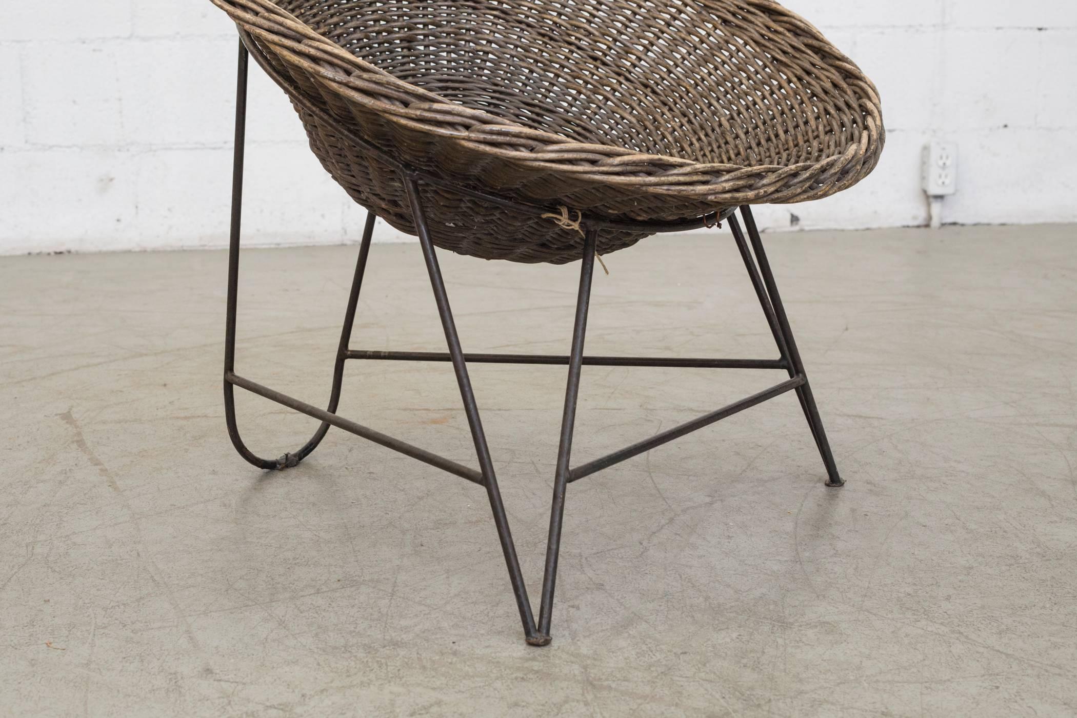 Dutch Jacques Adnet Style Natural Woven Rattan Basket Chair With Black Wire Base For Sale