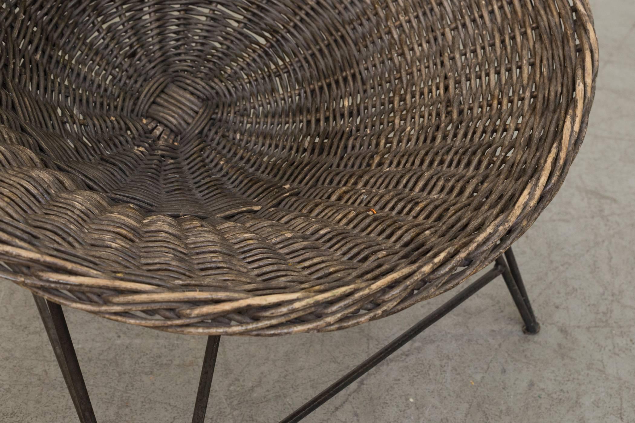 Jacques Adnet Style Natural Woven Rattan Basket Chair With Black Wire Base In Good Condition For Sale In Los Angeles, CA