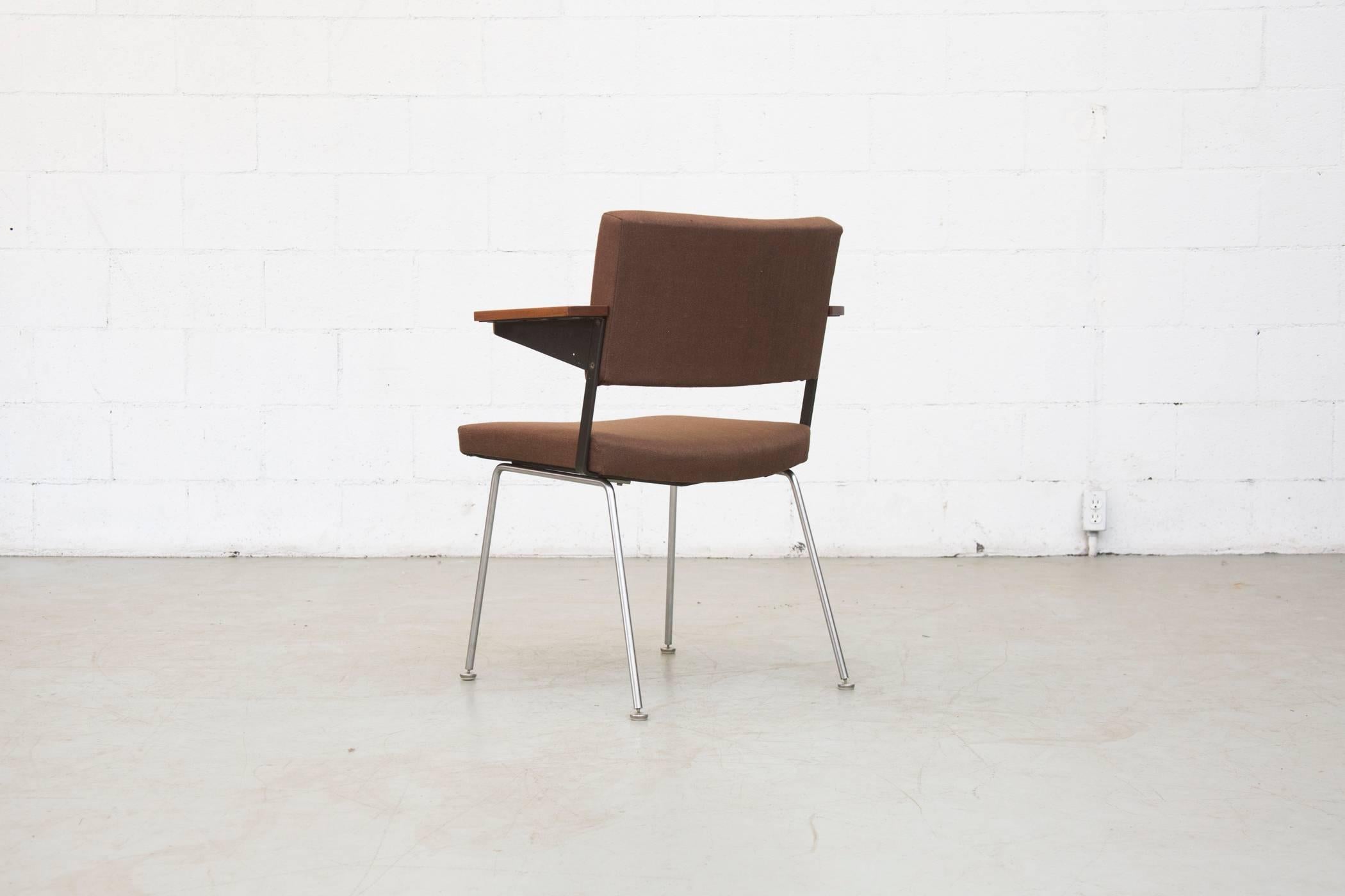 Great architectural Gispen chair no.11, newly upholstered in chocolate fabric with wide body, beautiful wooden armrests, chrome frame and brushed steel legs. Frame and arms in original condition with visible signs of wear consistent with their age