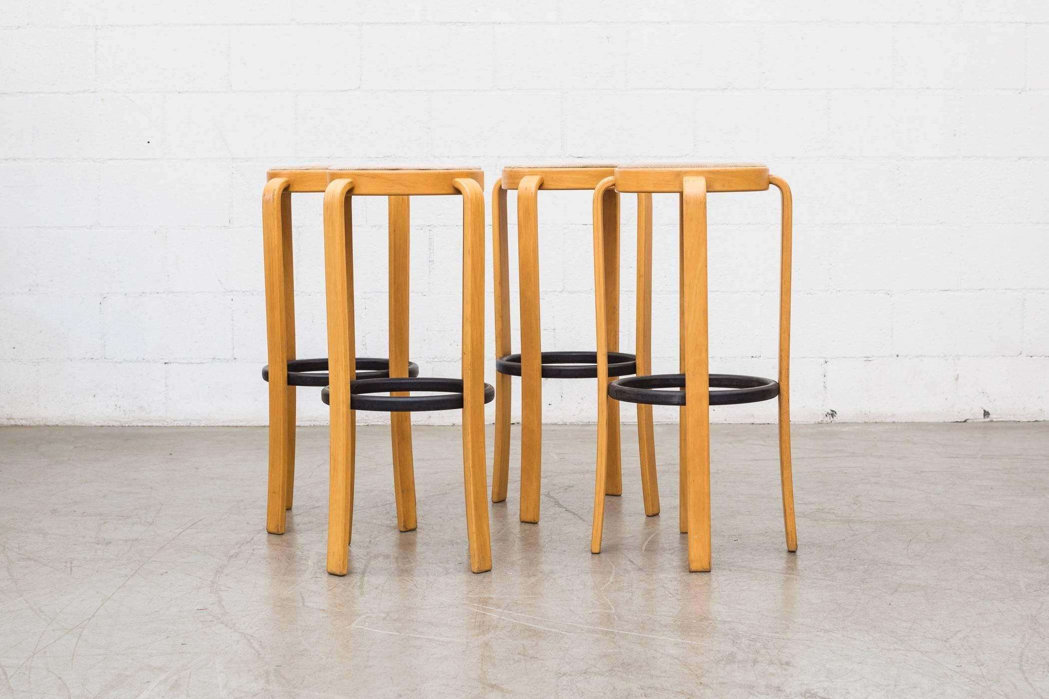 Birch bentwood legged bar stools in original condition with ebony foot rests and original corduroy seats. Two sets of four available.
Measures: 12.625/14.25 x 12.625/14.25 x 32.25.